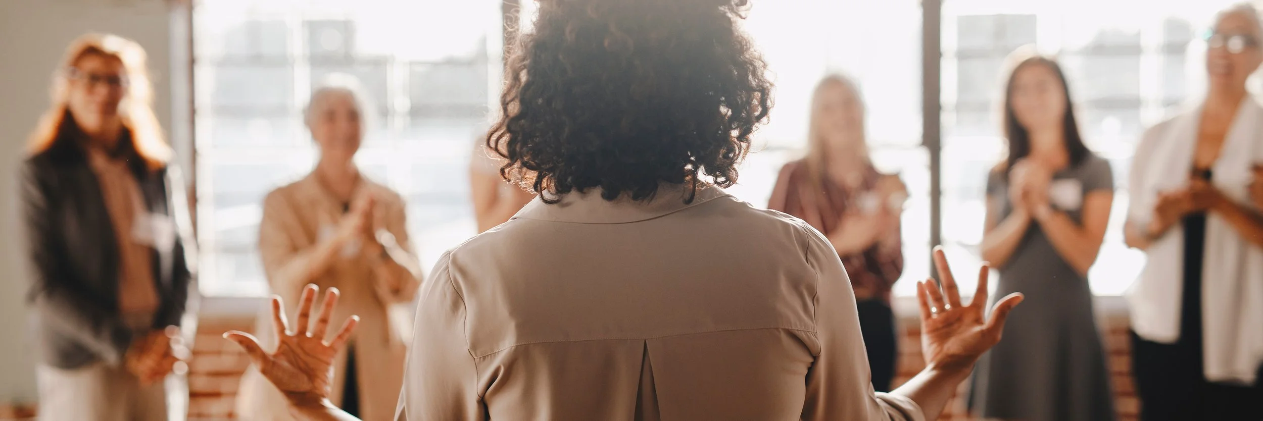 photo of a female business coach teaching entrepreneurs