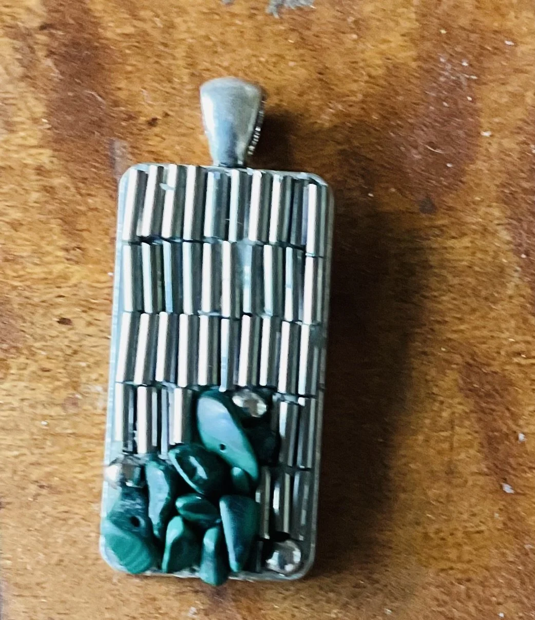 Silver plated pendant 40x20mm filled with silver coloured beads and natural stones