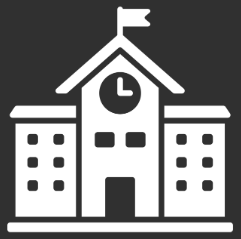 School building with a clock tower and a flag on top.