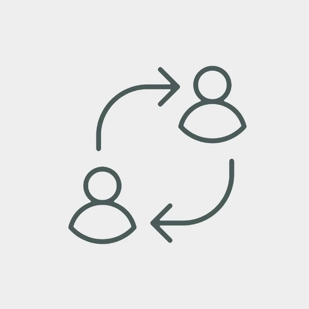 Icon of two people with arrows indicating communication or exchange between them.