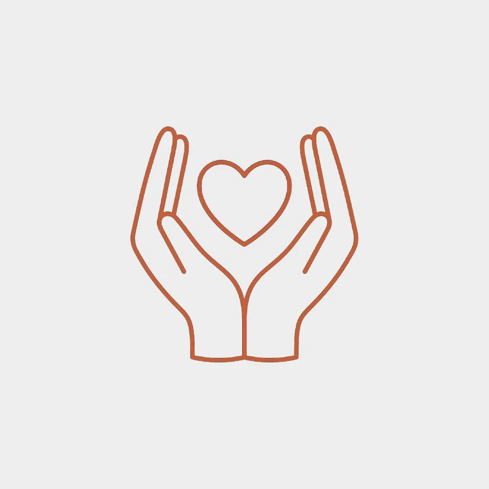 Line drawing of two hands holding a heart