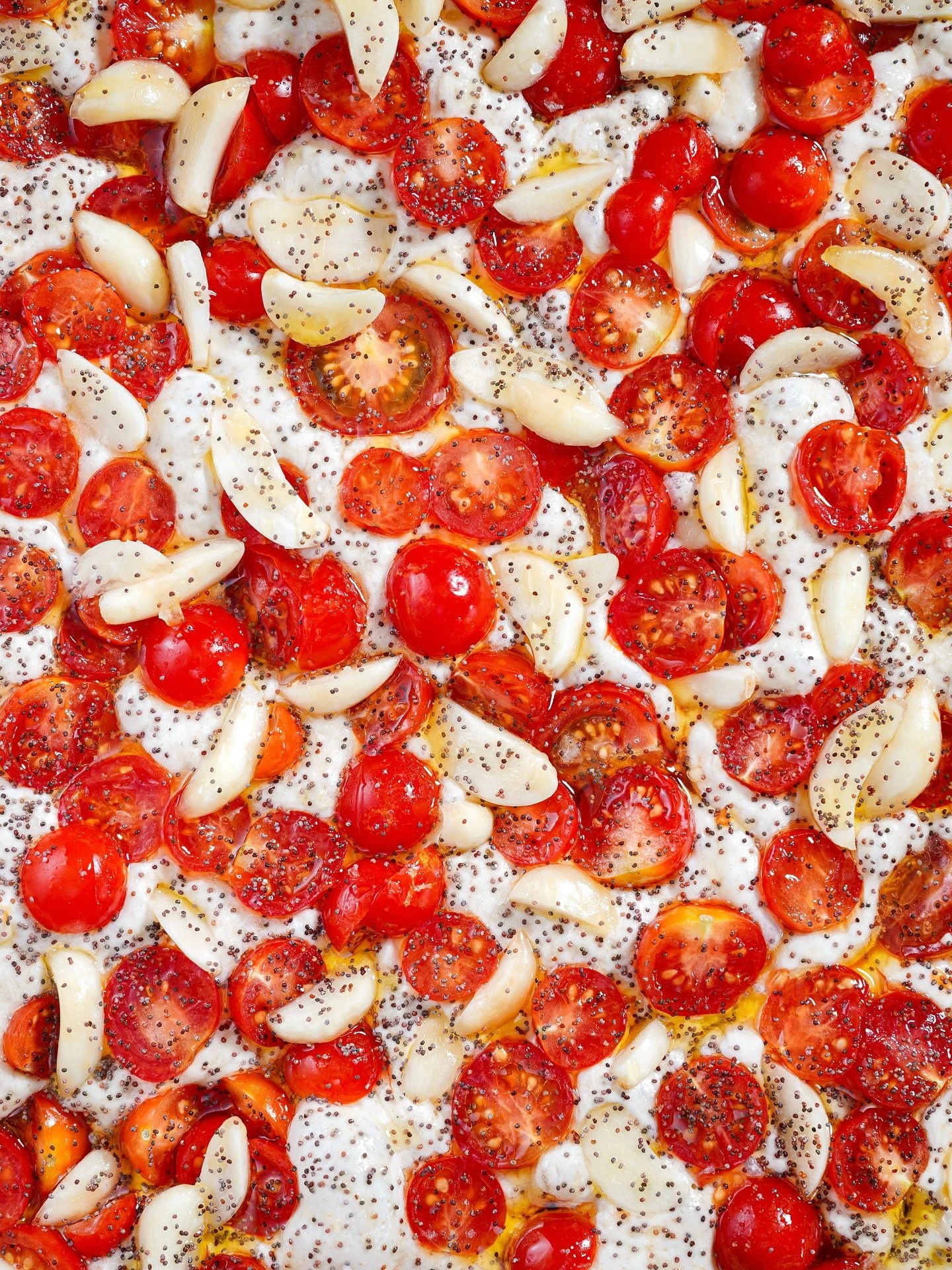 Slide to bake &rarr; 🍅🍞

Another round of focaccia, this time topped with:
&bull; Cherry tomatoes from the garden
&bull; Garlic
&bull; Garden-harvested poppy seeds (strictly for cooking...I promise!)
&bull; A heavy sprinkle of @maldonsalt

Once it 