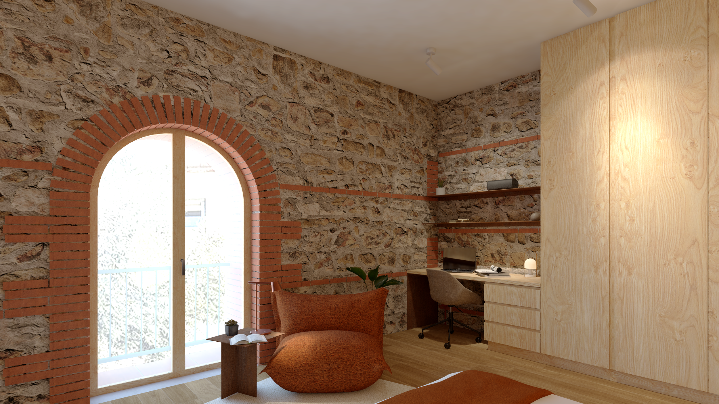 Un recoin lumineux et apaisé s'ouvre autour de l'espace lecture et du bureau. La grande ouverture cintrée d'origine baigne l'ensemble de lumière et rappelle la mémoire du lieu tout comme les murs en pierre apparents. 