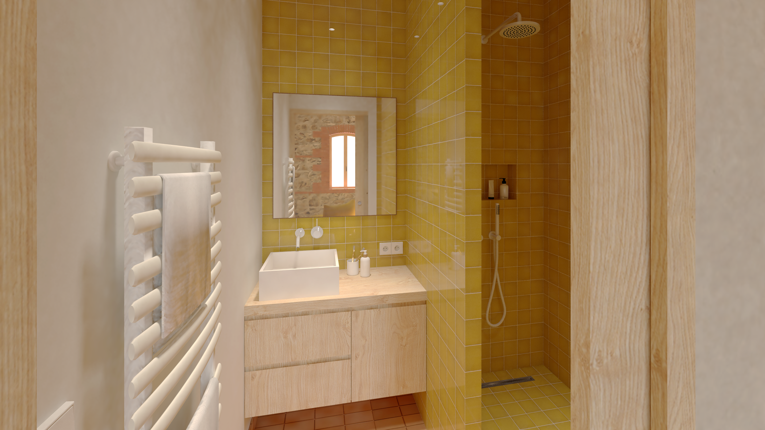 La salle de bain de Diego s'organise dans une ambiance douce entre la terre cuite contemporaine au sol et l'éclat profond des carreaux émaillés jaune moutarde. 