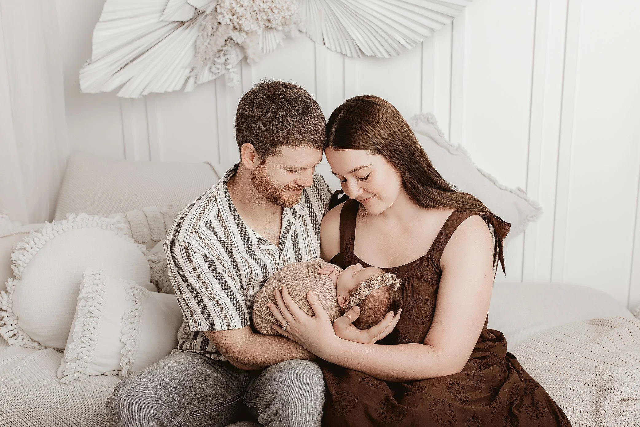 Family of three with newborn baby captured in Ipswich photography studio