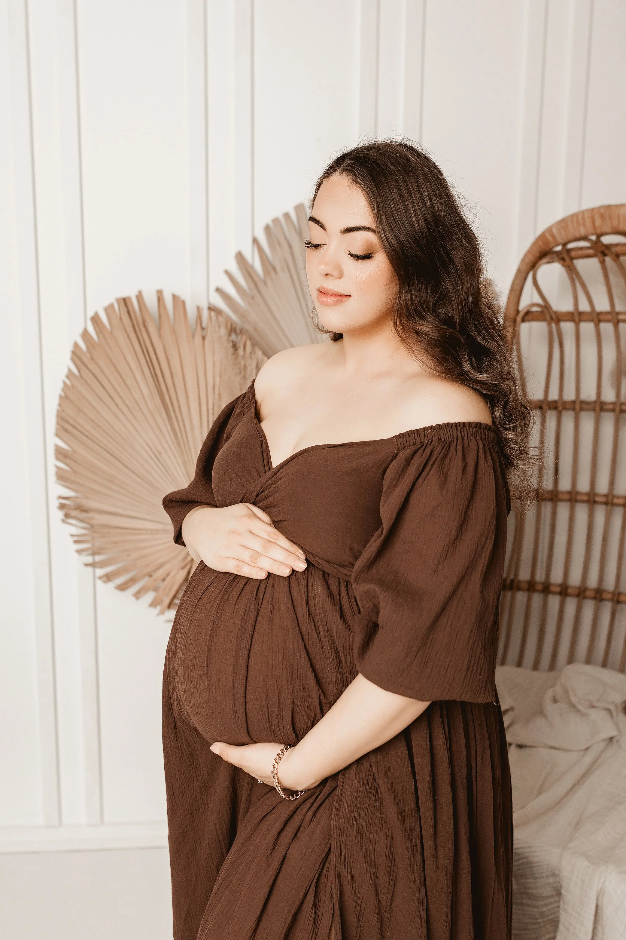 Ipswich maternity photographer capturing mum to be in neutral studio setting