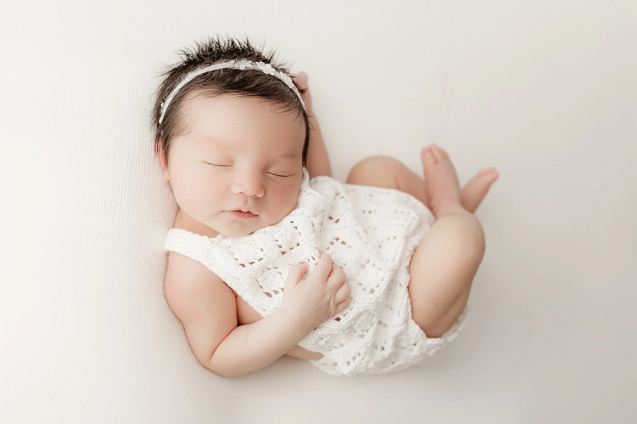 Ipswich newborn photographer capturing early days with soft neutral styling