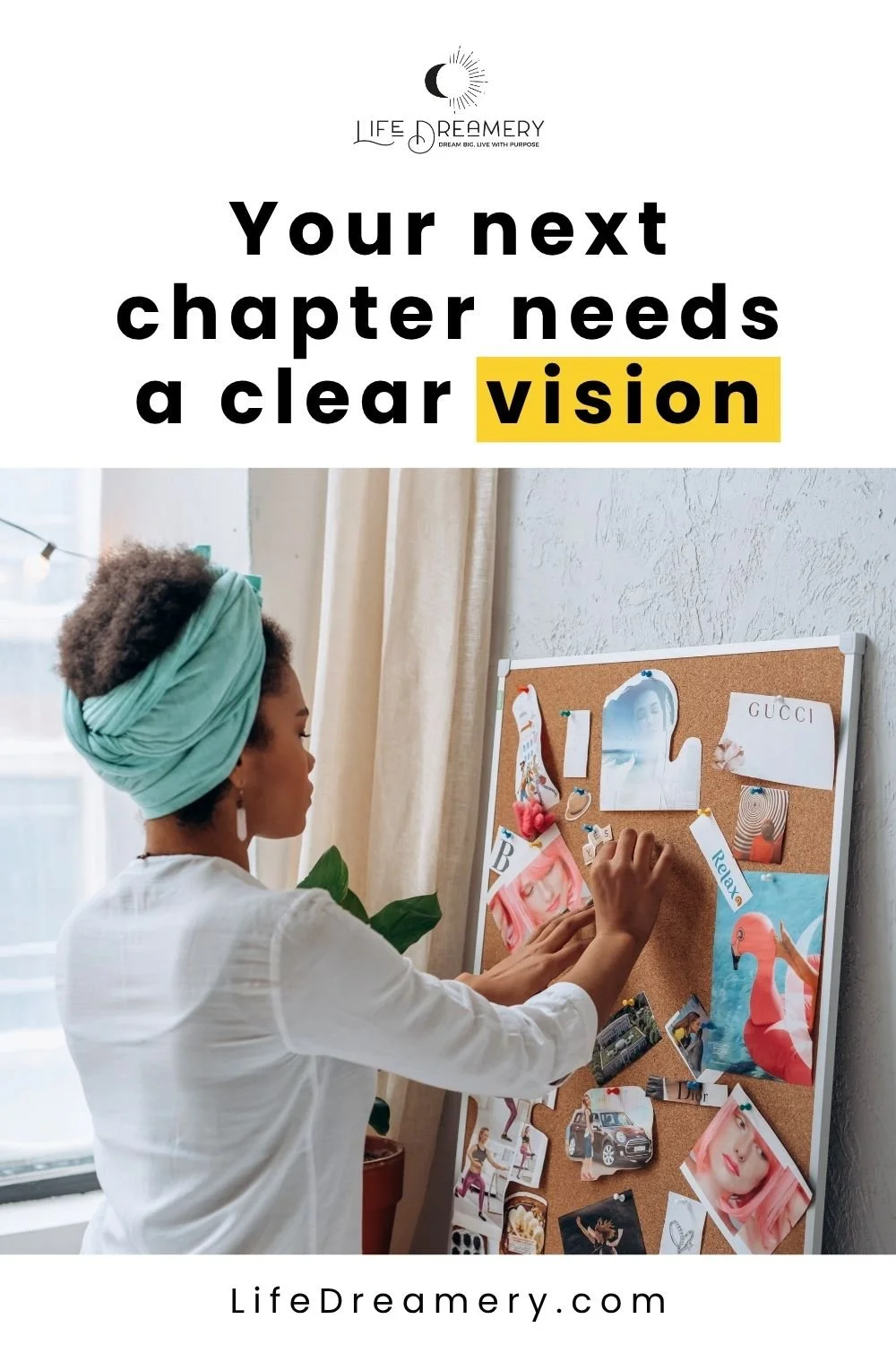 A young woman making a vision board for her dreams by pinning images to a corkboard