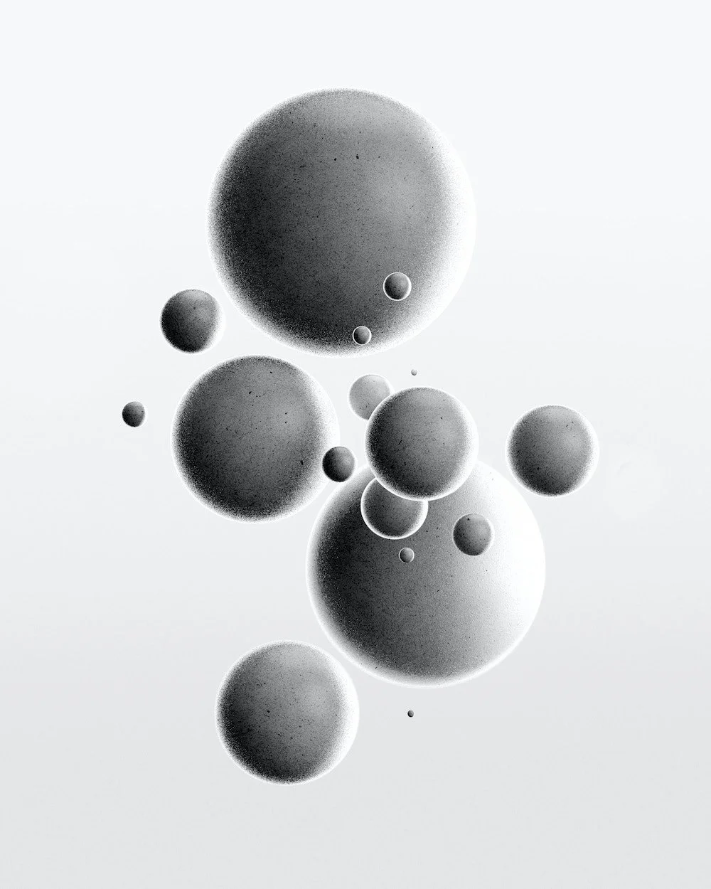 Abstract image of floating grey spheres on a pale background.