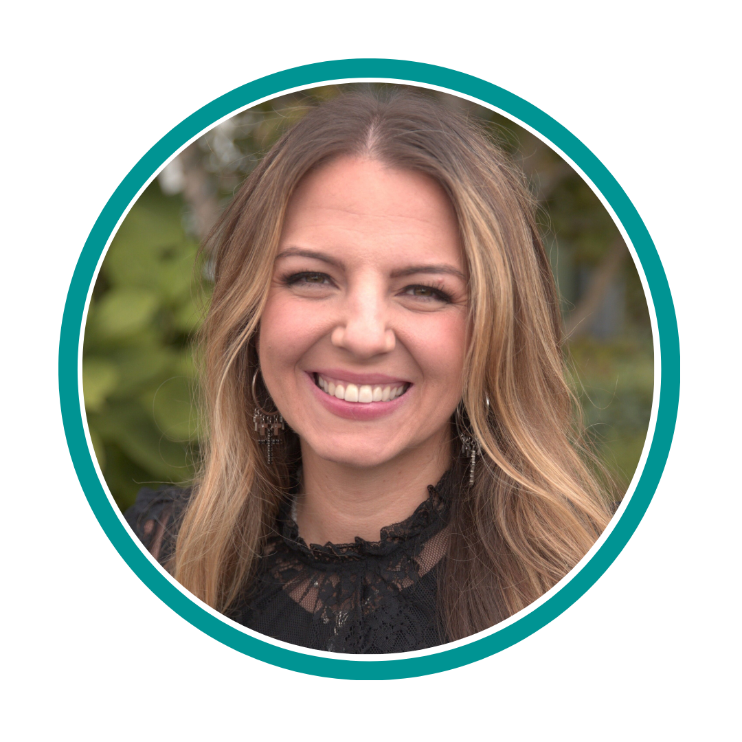 Portrait of a smiling woman with long hair, wearing a black lace top, surrounded by a teal circular frame.