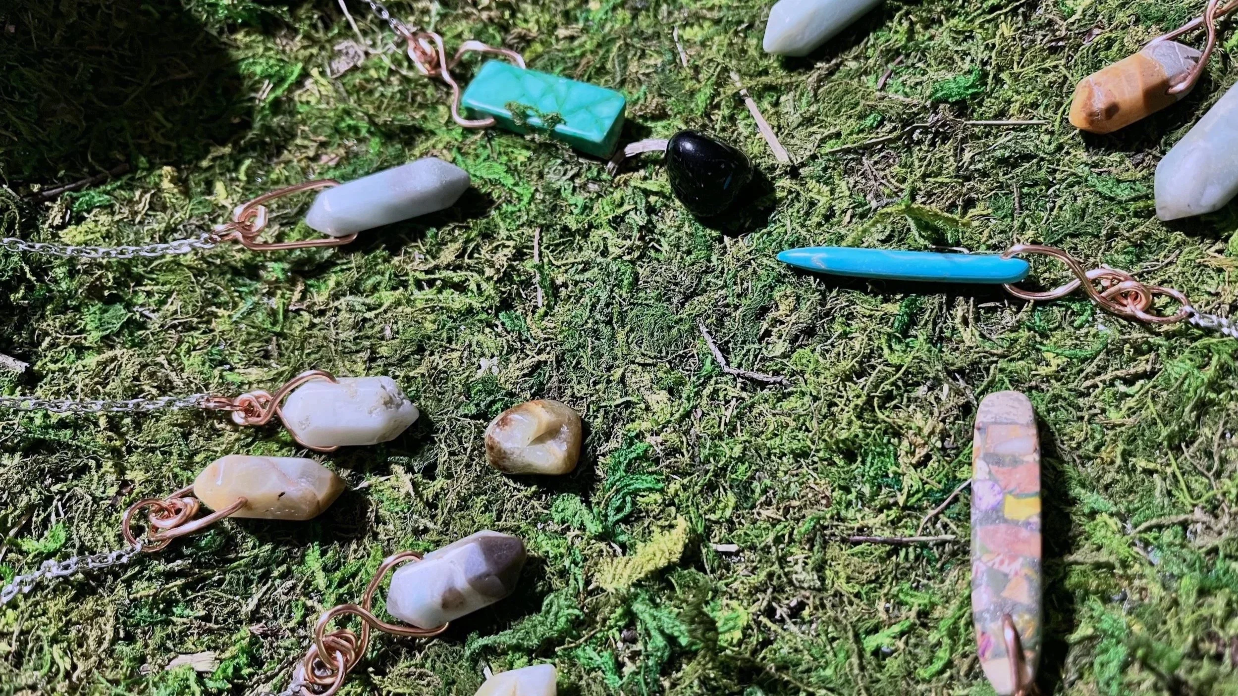 Image of multiple pendulums on moss