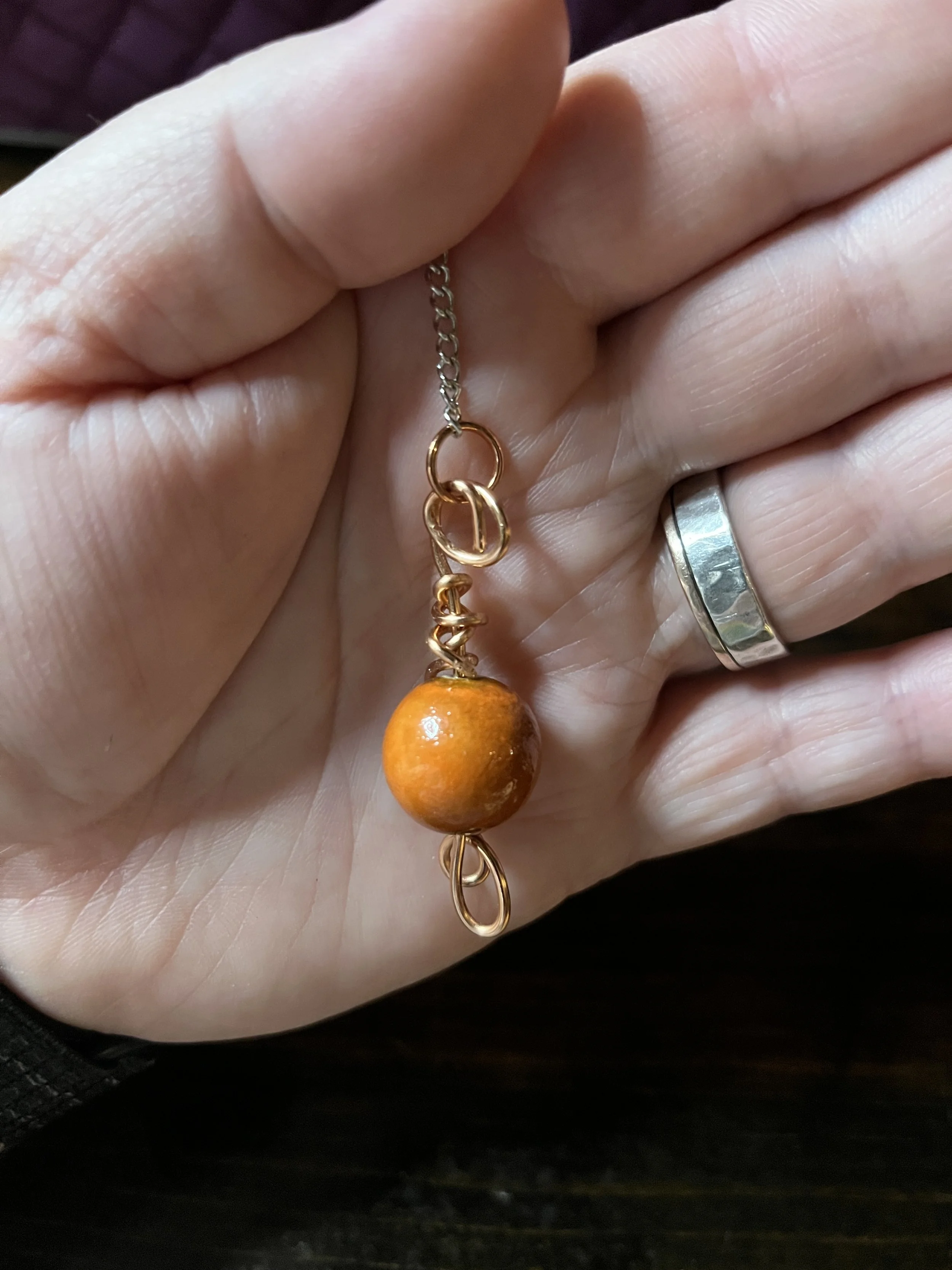 Orange ceramic pendulum 