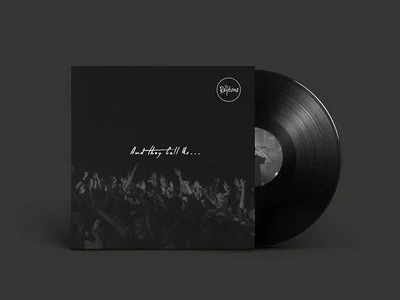 Vinyl record album with black cover and crowd photo, featuring the text 'live History tell all...'.