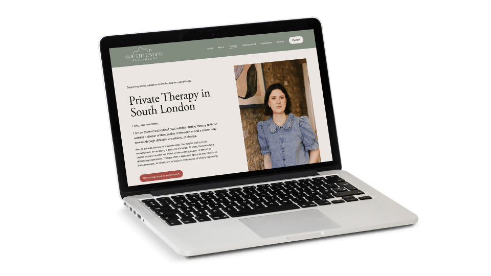 Laptop displaying the website homepage for South London Psychology