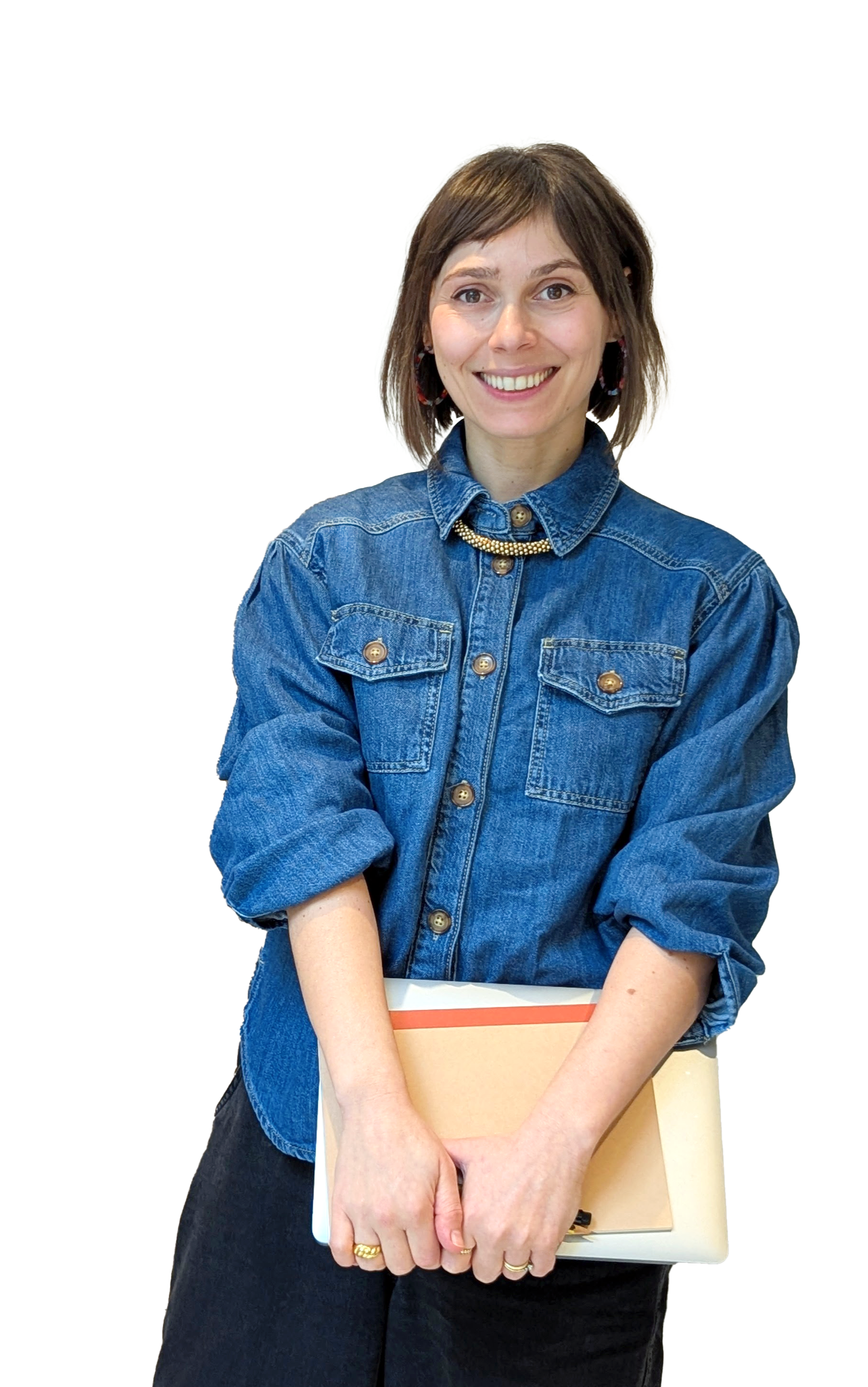 cutout  photo of Tanya Coyle, Squarespace website designer, smiling and holding a notebook and closed laptop