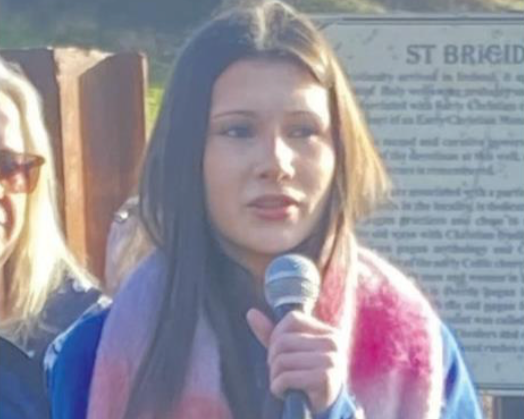  Iseult Ni Chonalláin singing a rendition of We Sing A Song to Brigid at the unveiling of the restored St. Brigid's Well. 