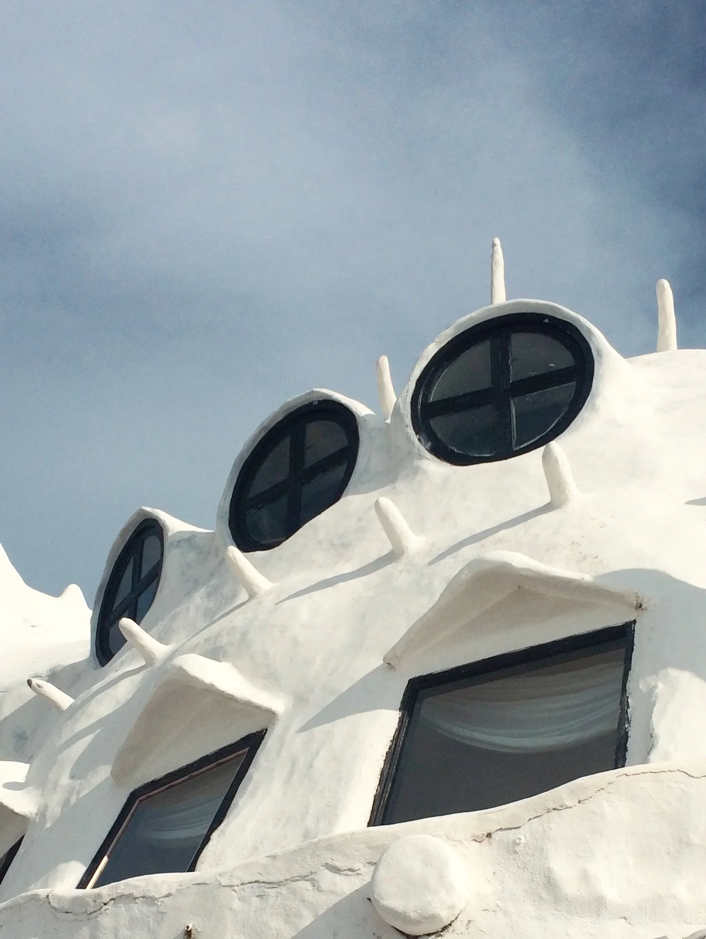 A sculpture you can inhabit.

Started in 1958 by Uruguayan artist Carlos P&aacute;ez Vilar&oacute;, Casapueblo grew organically on the cliffs of Punta Ballena, facing the Atlantic.

Built in masonry and reinforced concrete, finished in hand-applied w