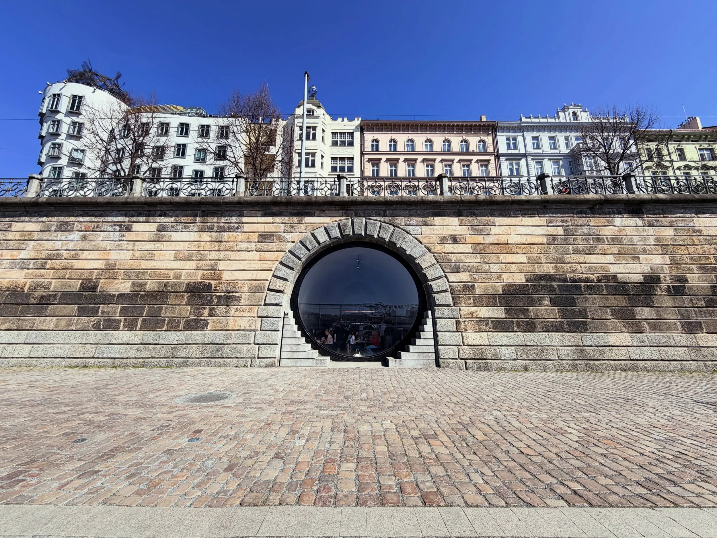 Prague&rsquo;s riverfront revitalization by @brainwork_architects completed in 2020.

19 of the embankment&rsquo;s 26 former riverfront vaults were transformed after nearly two decades of disuse into caf&eacute;s, galleries, and public space along th