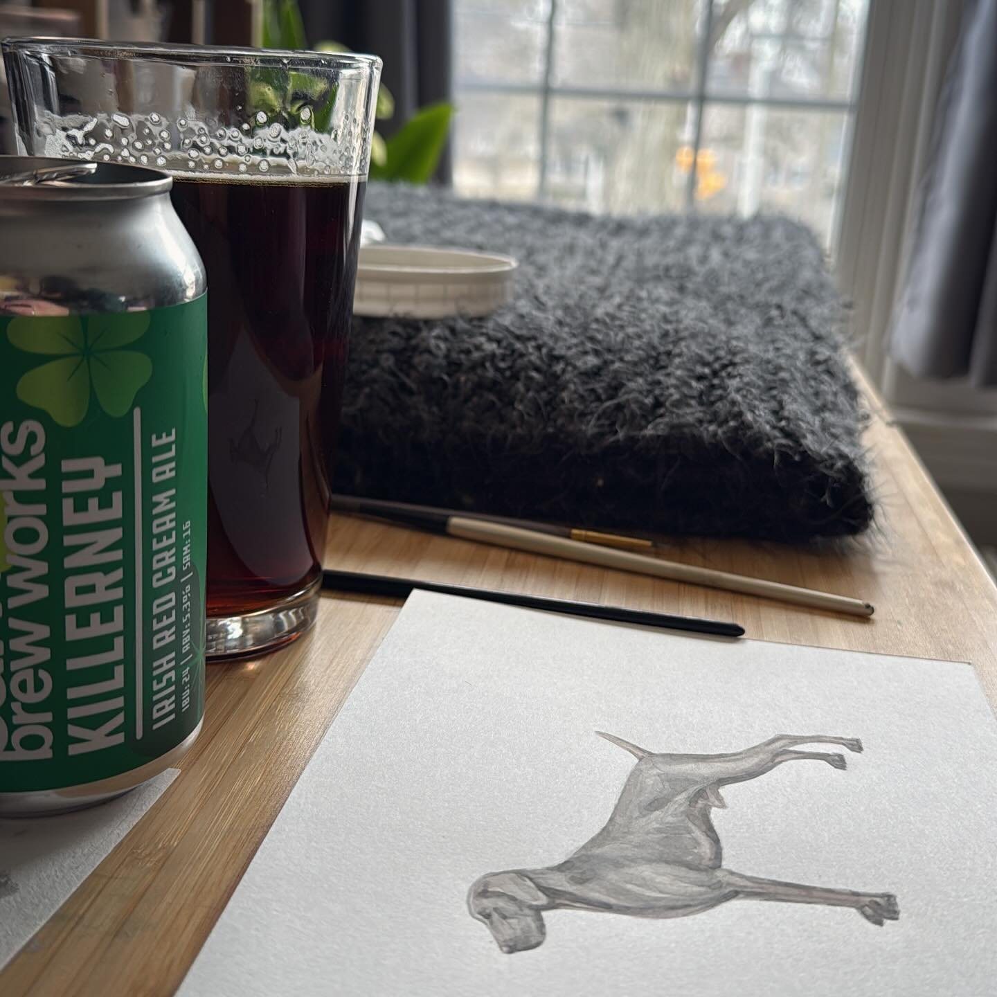 Embracing a cold and cloudy March day. 🎨 🌥️ ☘️ 🍻 
Also, a rare cat free table!