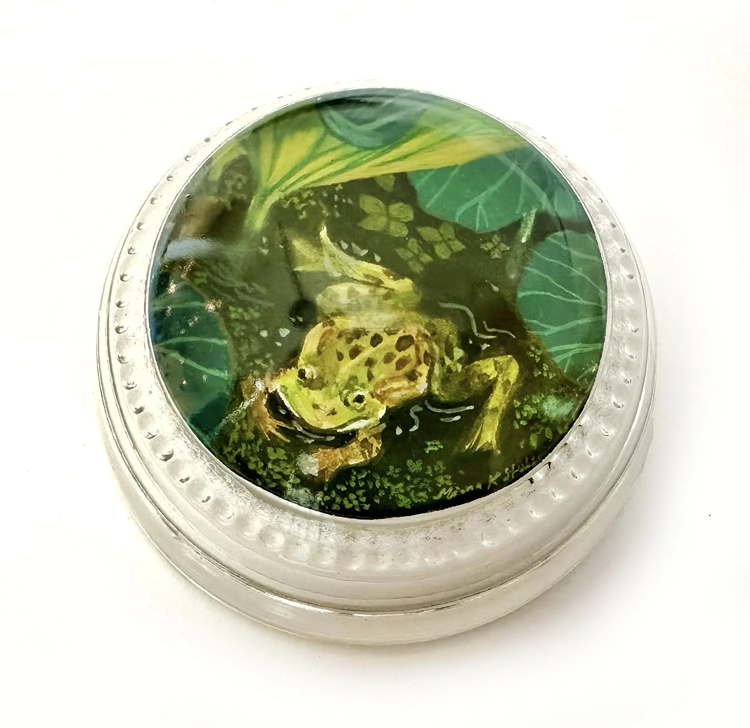 Miniature gouache frog painting in paperweight glass.