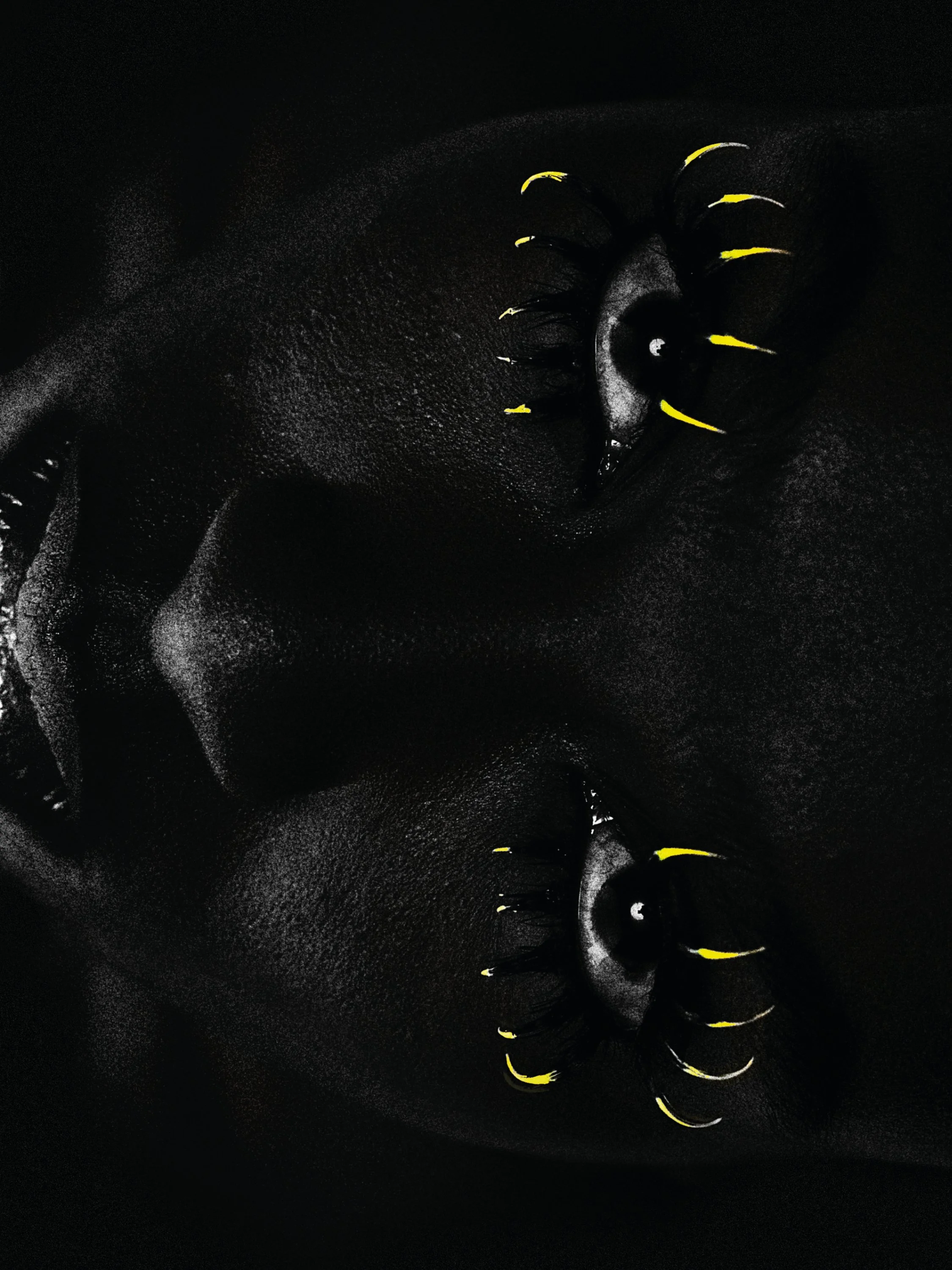 Close-up of a person's face, with yellow tipped eye lashes. High contrast image.