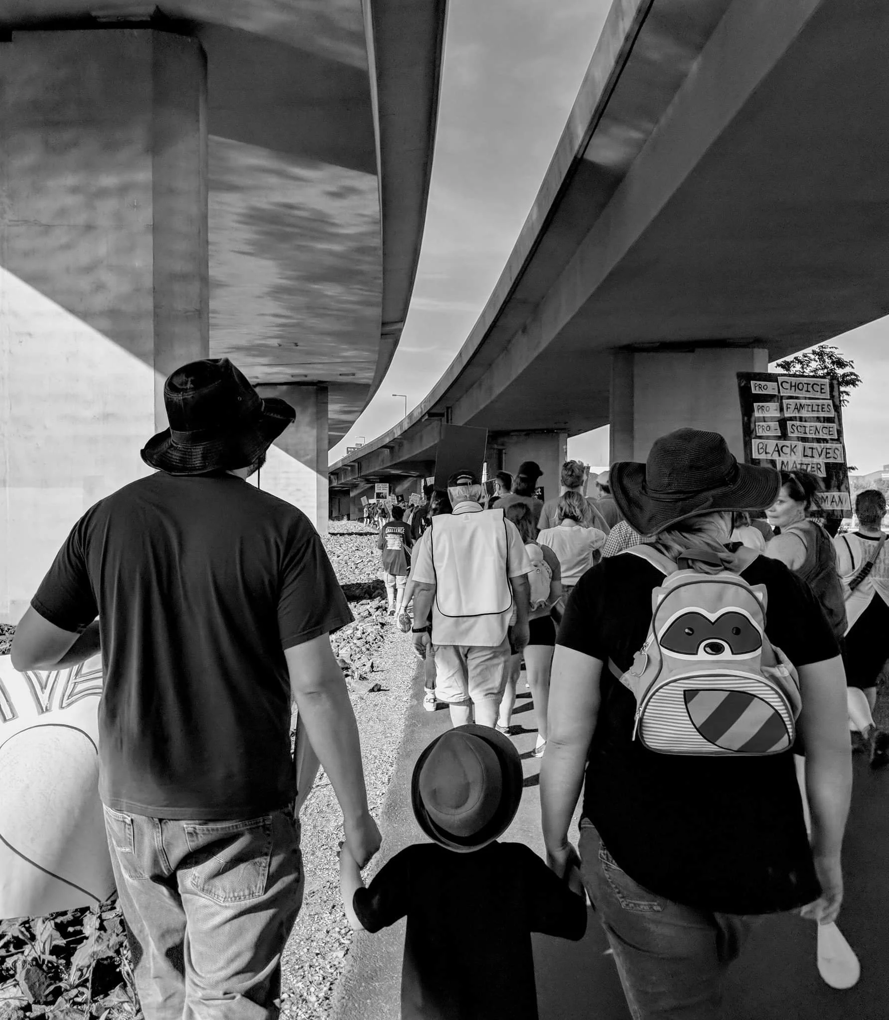 Family of three march in protest of Donald Trump visiting Duluth, Minnesota