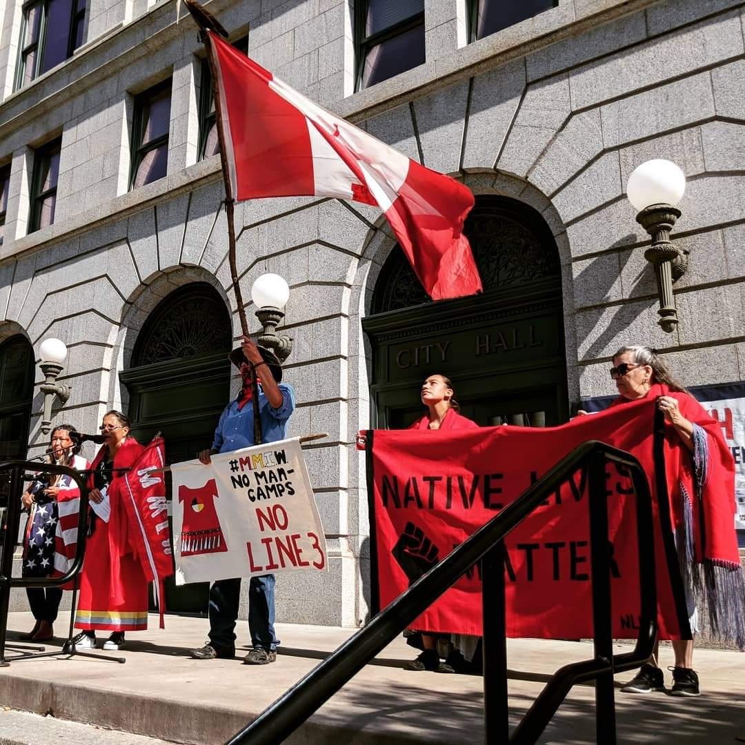 Native Lives Matter organization members stand in unity as they speak out against Line 3 oil pipeline in Duluth, Minnesota