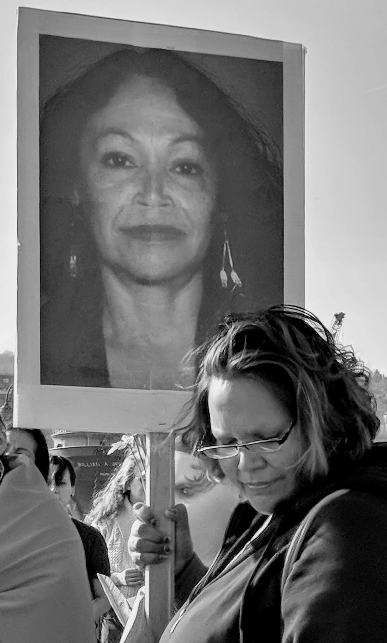 The eldest daughter of Sheila St. Clair, who has been missing since September 1, 2015, holds her photo during a Missing and Murdered Indigenous Women gathering in Duluth, Minnesota