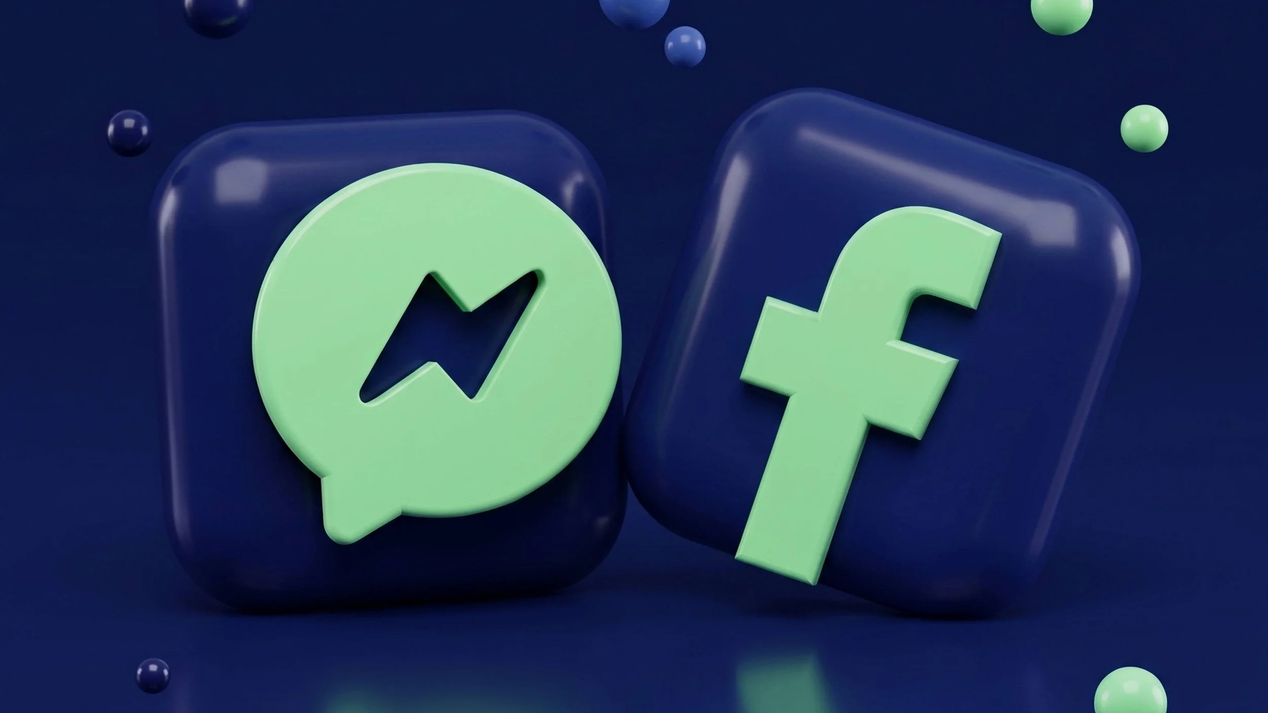 Close-up of green and black 3D chat and lightning bolt icons on a dark background.