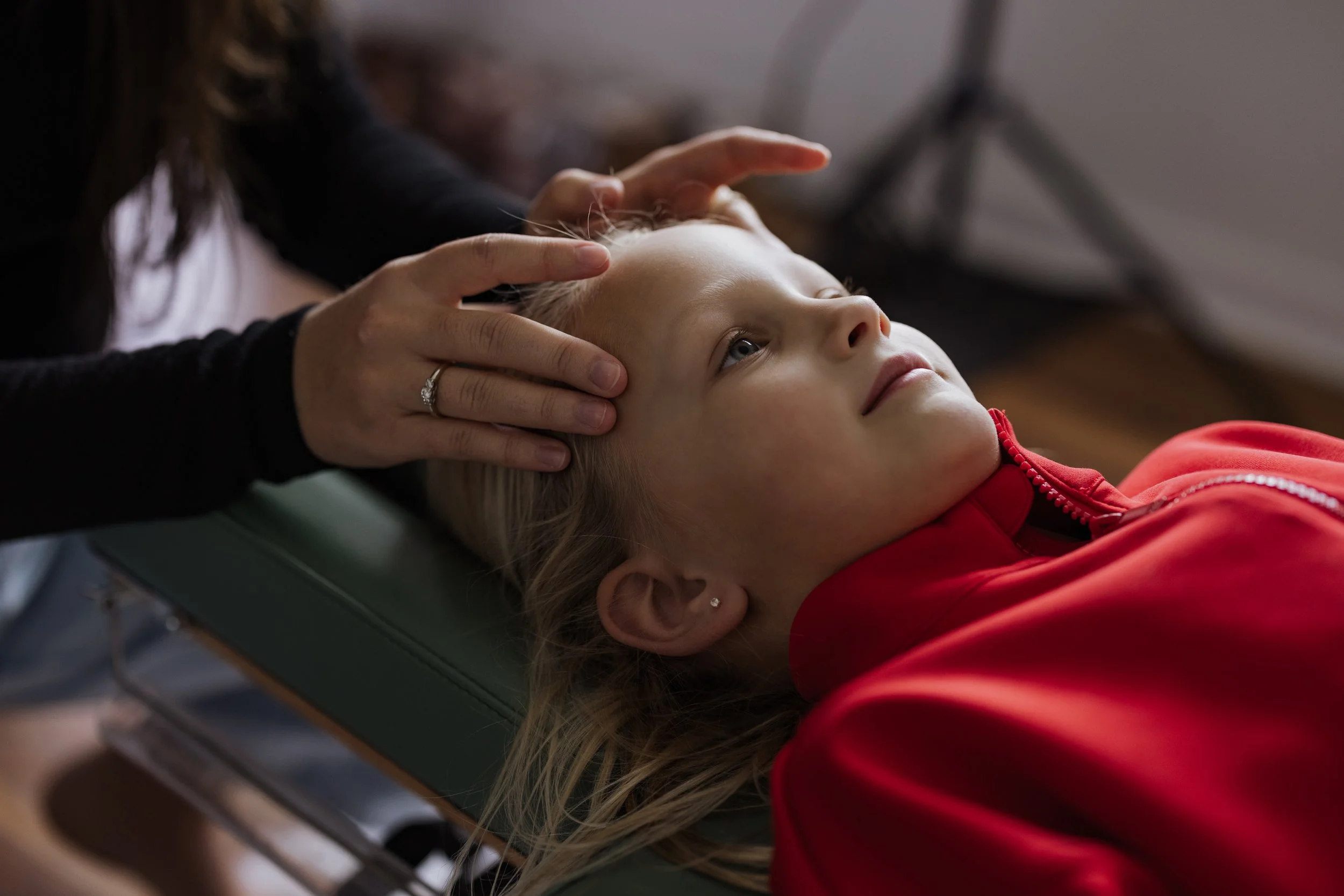 Dr. Justyce adjusting pediatric patient at Buffalo Family Chiropractic”