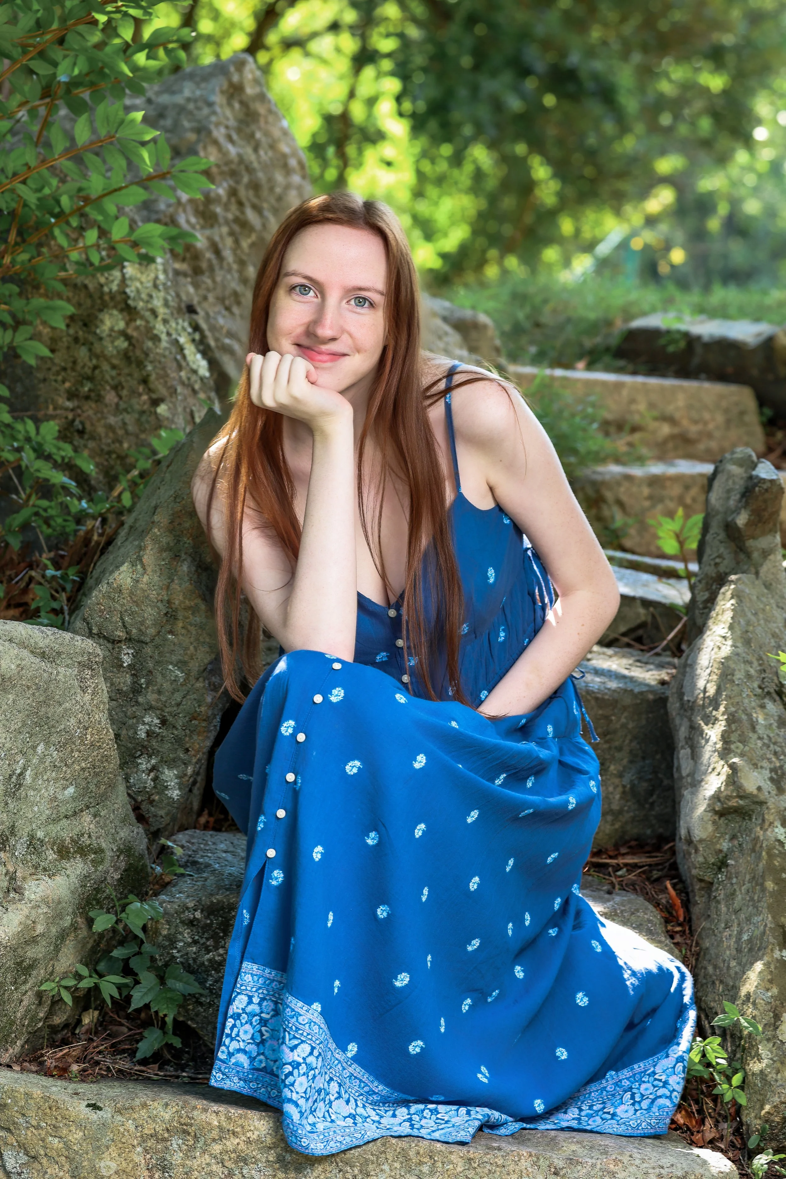 Outdoor high school senior portrait in a blue dress photographed in Massachusetts by Kelliann Bachand Photography