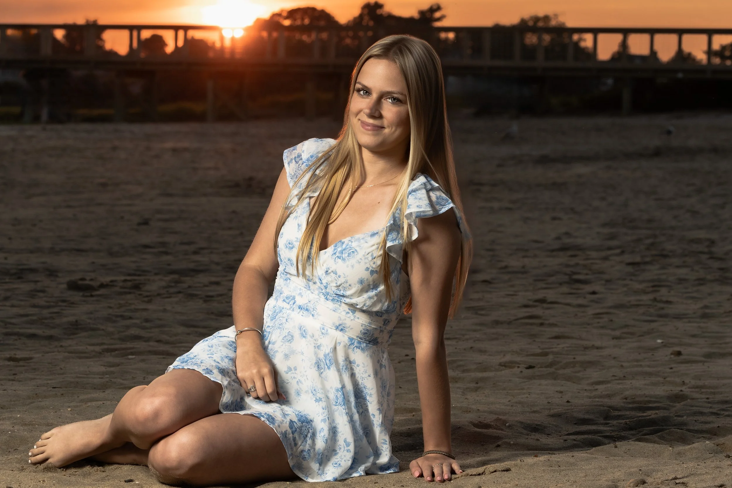 Sunset high school senior portrait of a teenage girl photographed outdoors in Massachusetts by Kelliann Bachand Photography