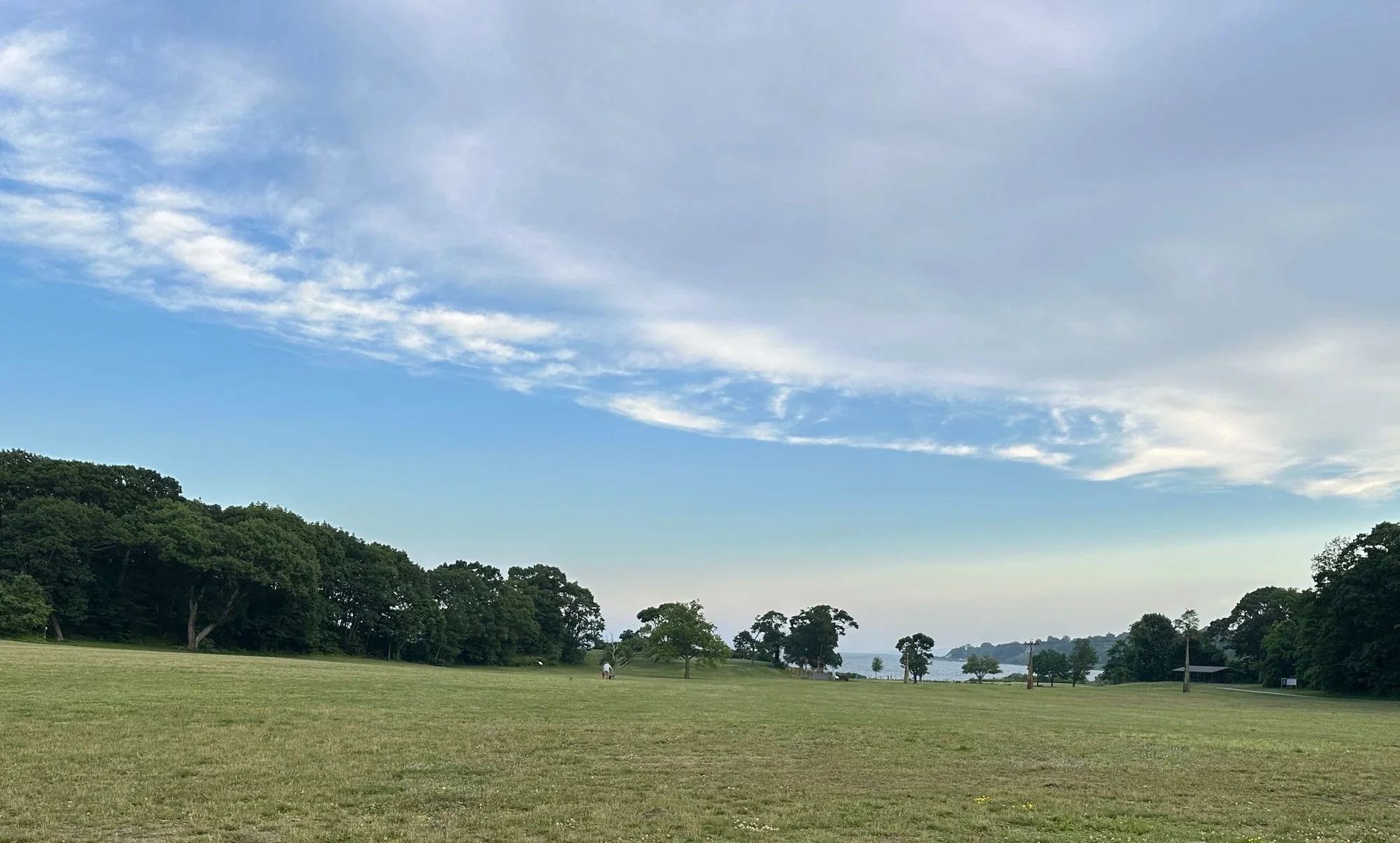 Open grassy field overlooking Narragansett Bay at Rocky Point State Park in Warick, Rhode Island.