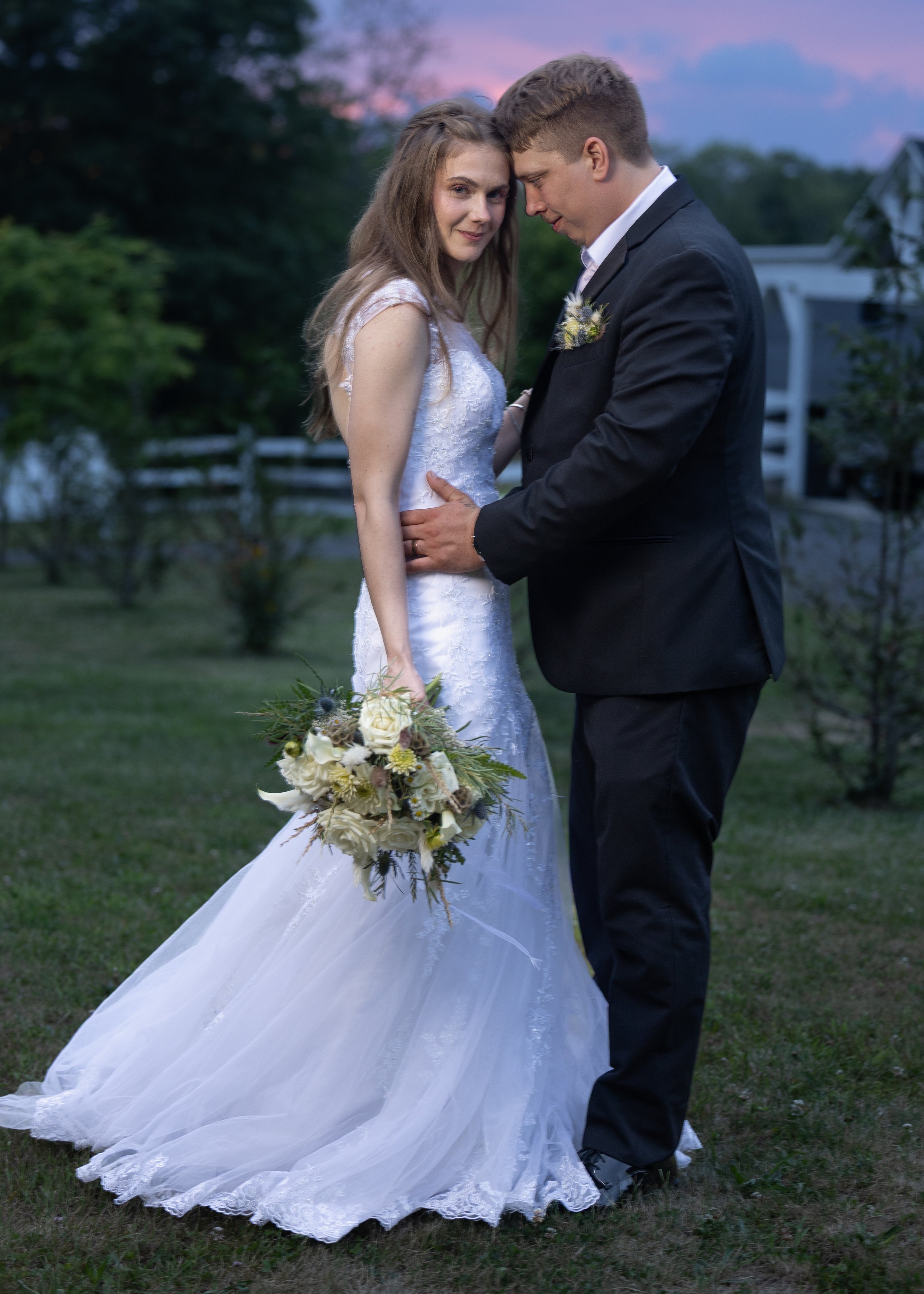 Bride and groom share a quiet sunset moment at Five Bridge Inn in Rehoboth, Massachusetts.