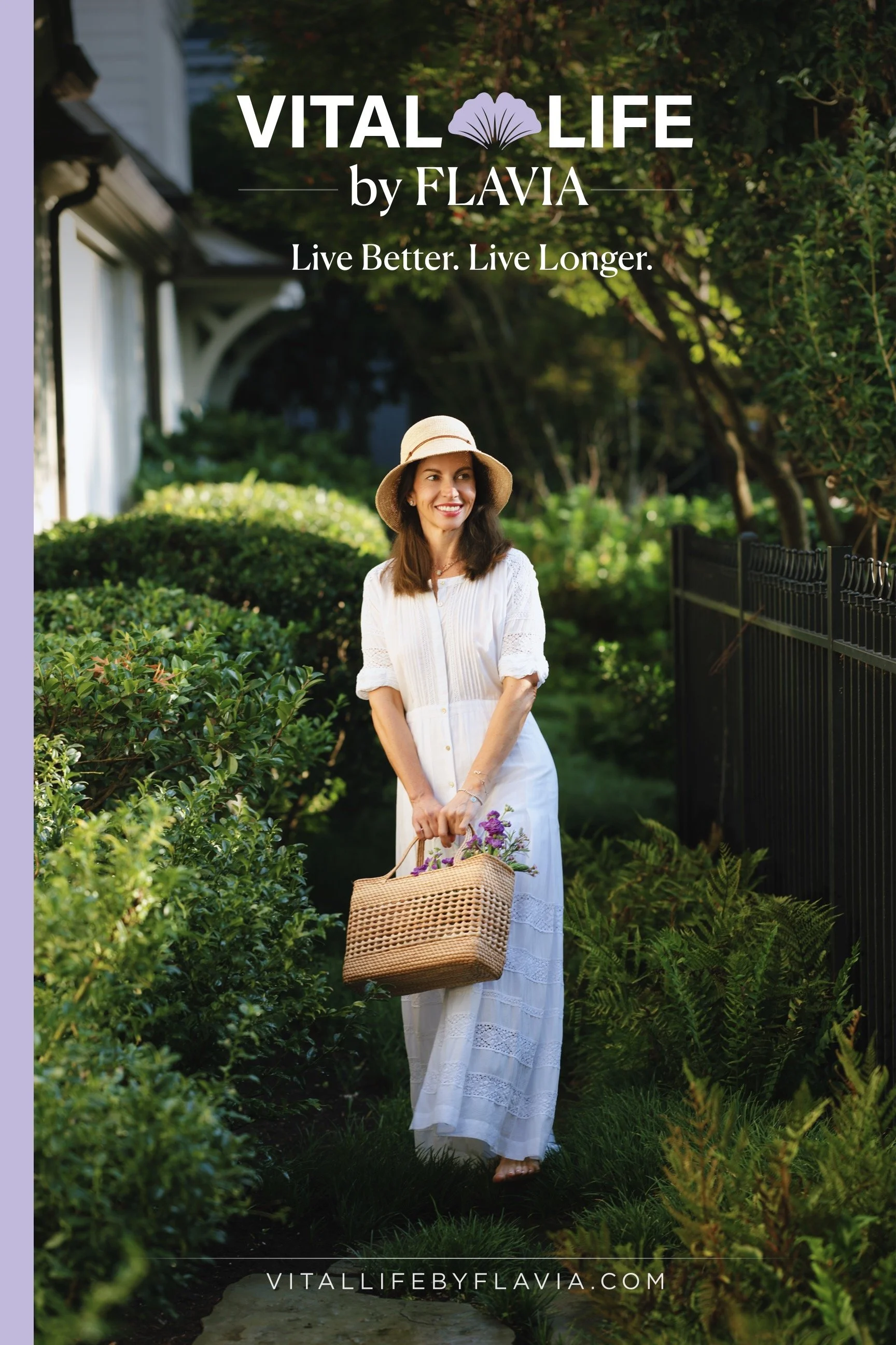 24x36 poster printed on foam core.  A woman in a white dress and wide-brimmed hat holding a woven basket with purple flowers, standing in a lush green garden with trees and bushes, sunny outdoor scene.
