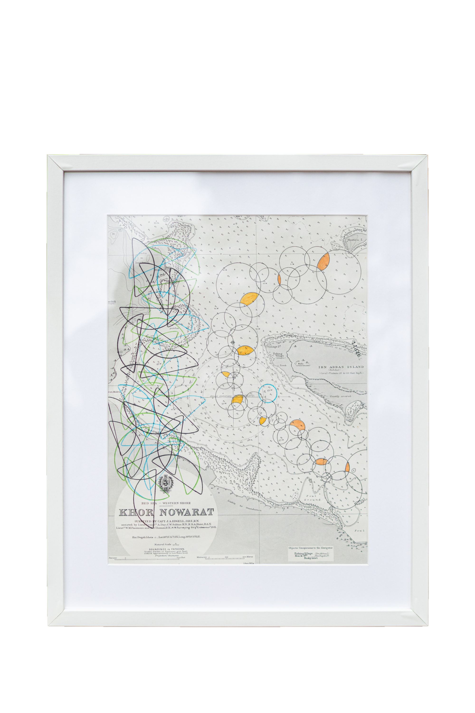Framed abstract art with nautical map featuring colorful geometric patterns