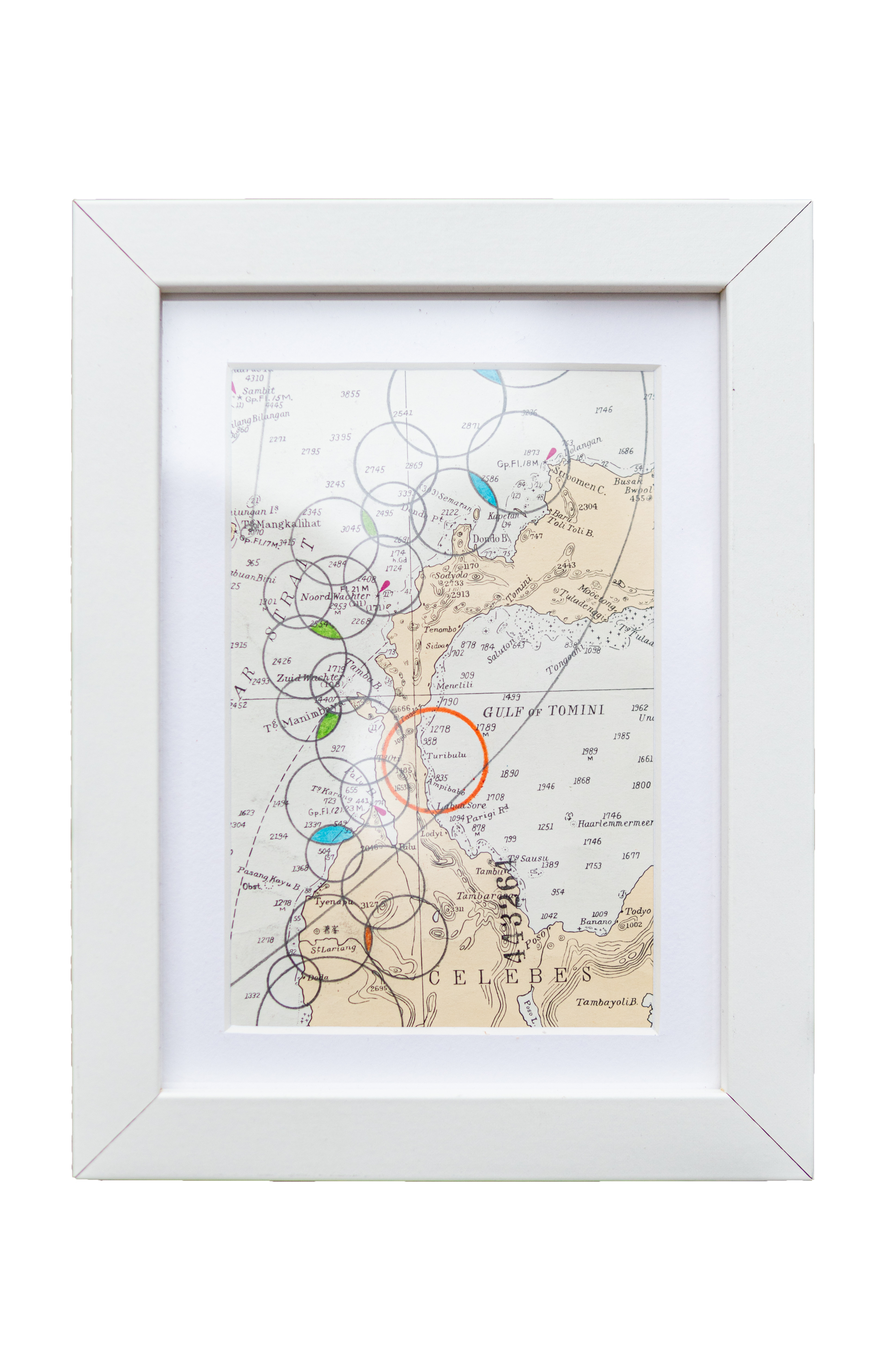 Framed vintage map artwork with circles and colors on Sulawesi, Indonesia.