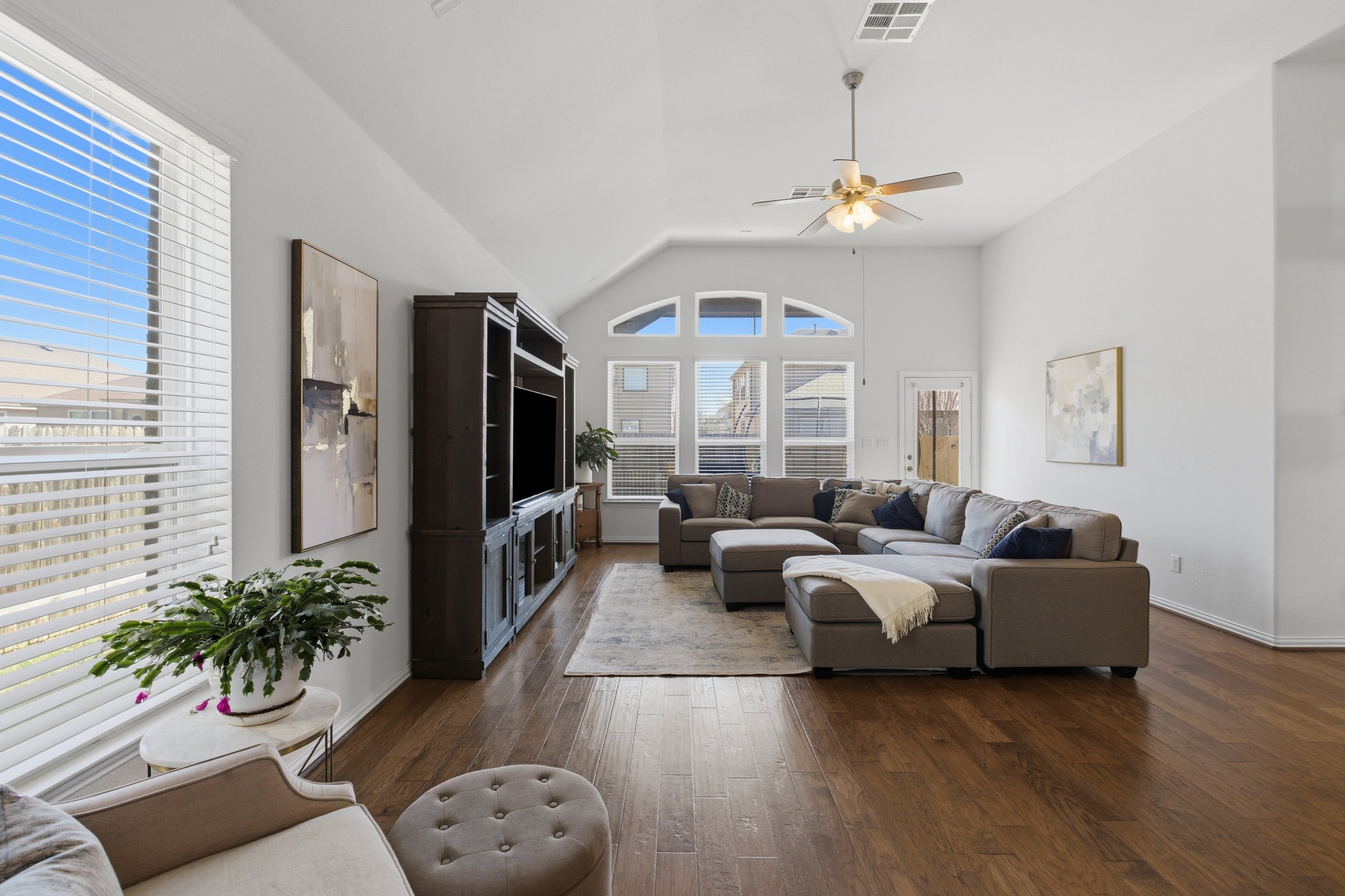 Modern kitchen at 5386 Parma St Round Rock TX featuring granite countertops, large island, and stainless steel appliances.