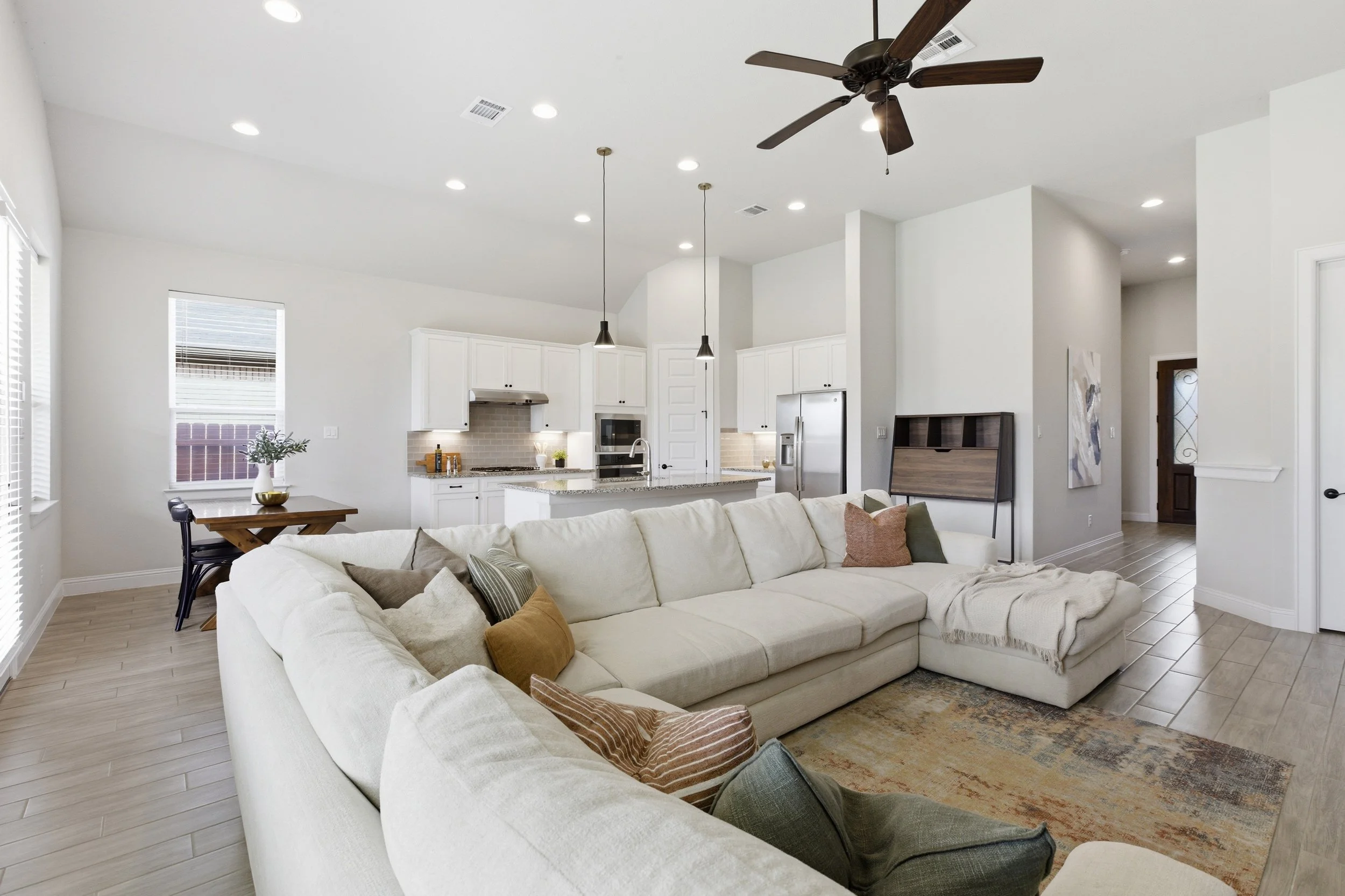 Living room connects to the kitchen and dining, open concept, spacious, lots of windows | Georgetown, TX