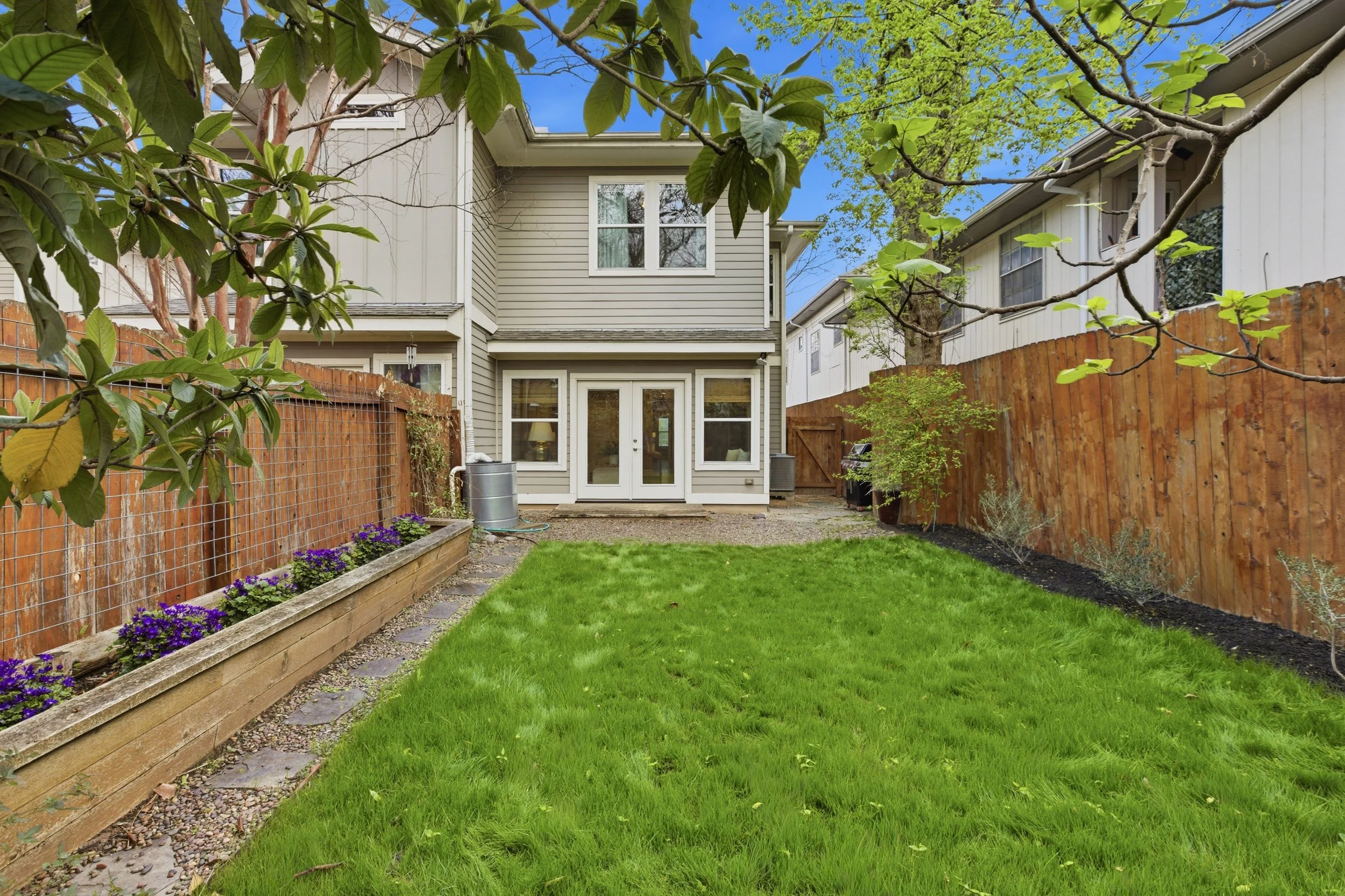 Private backyard in Brentwood Austin TX condo with patio and low-maintenance landscaping.