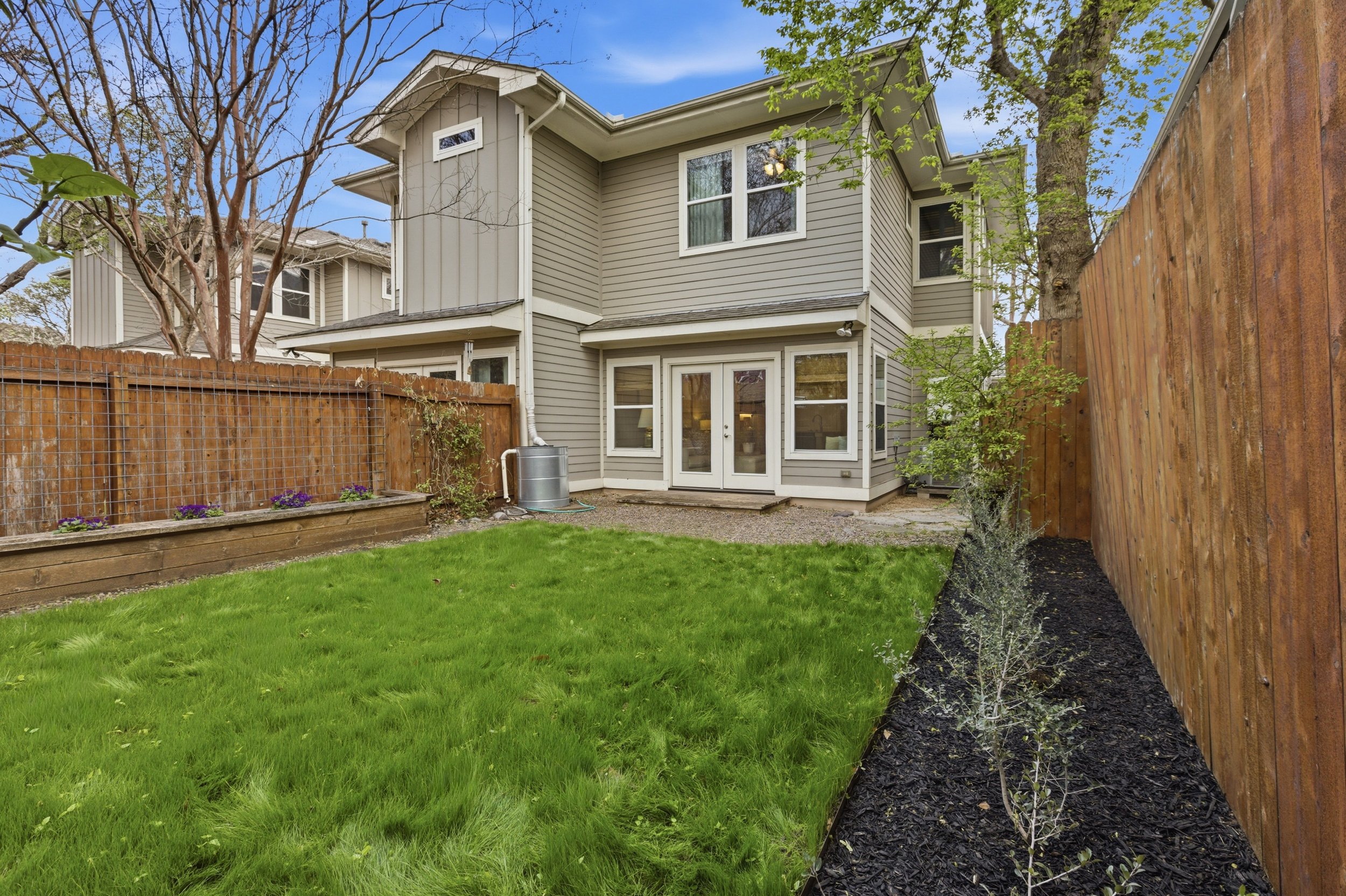 Private backyard in Brentwood Austin TX condo with patio and low-maintenance landscaping.