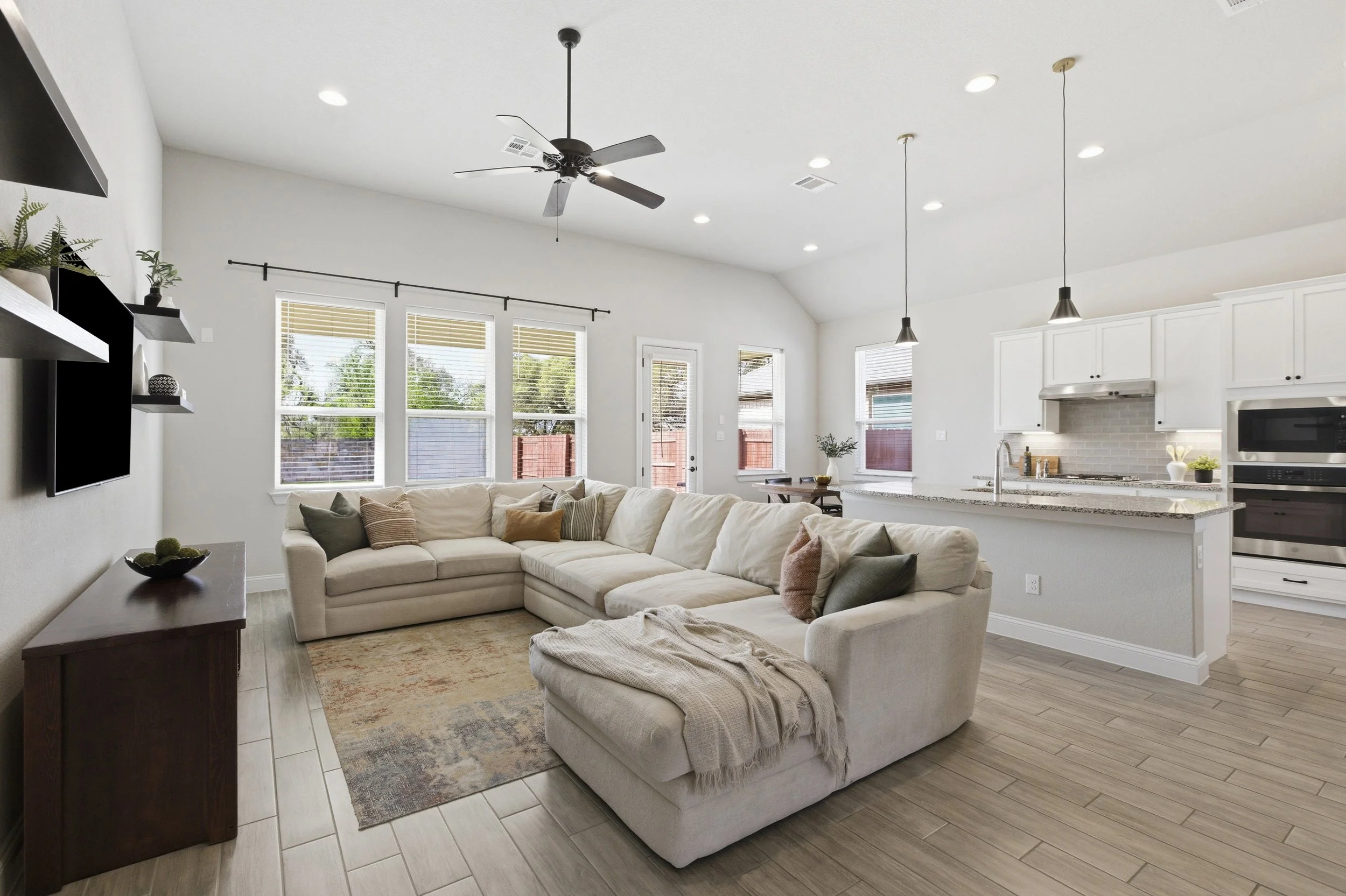 Living room connects to the kitchen and dining, open concept, spacious, lots of windows | Georgetown, TX
