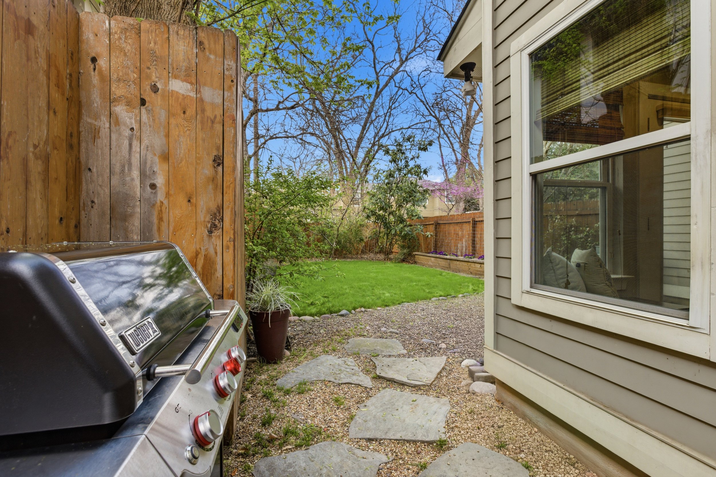 Private backyard in Brentwood Austin TX condo with patio and low-maintenance landscaping.