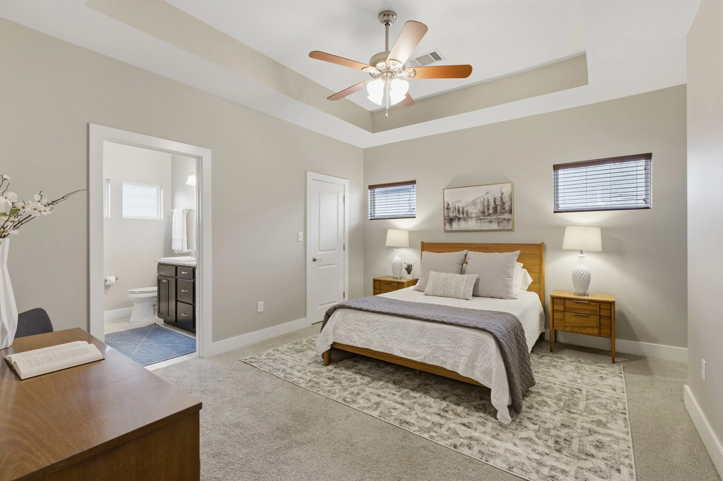 Private primary bedroom retreat in Brentwood Austin TX condo with soft natural light.