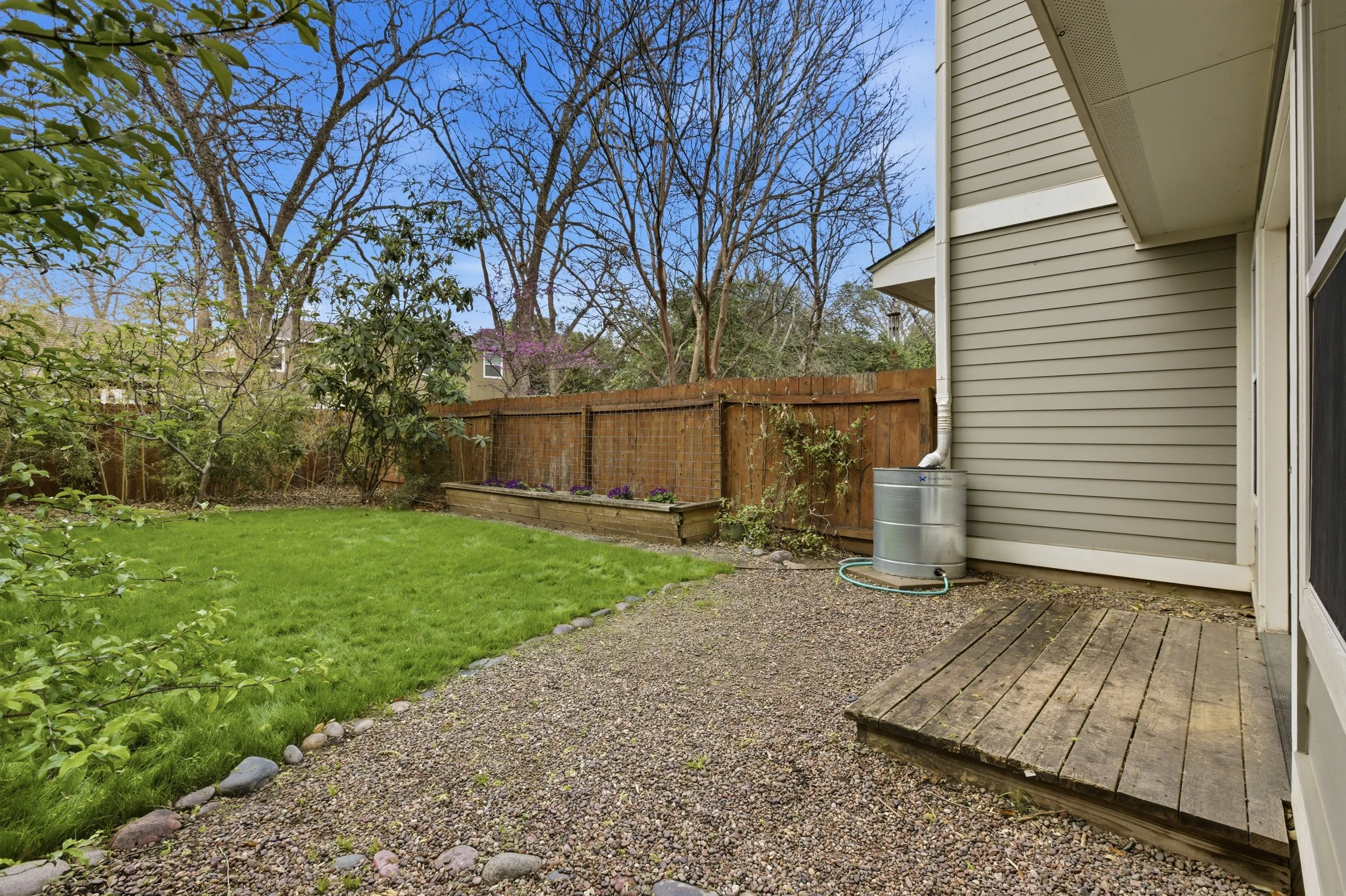 Private backyard in Brentwood Austin TX condo with patio and low-maintenance landscaping.
