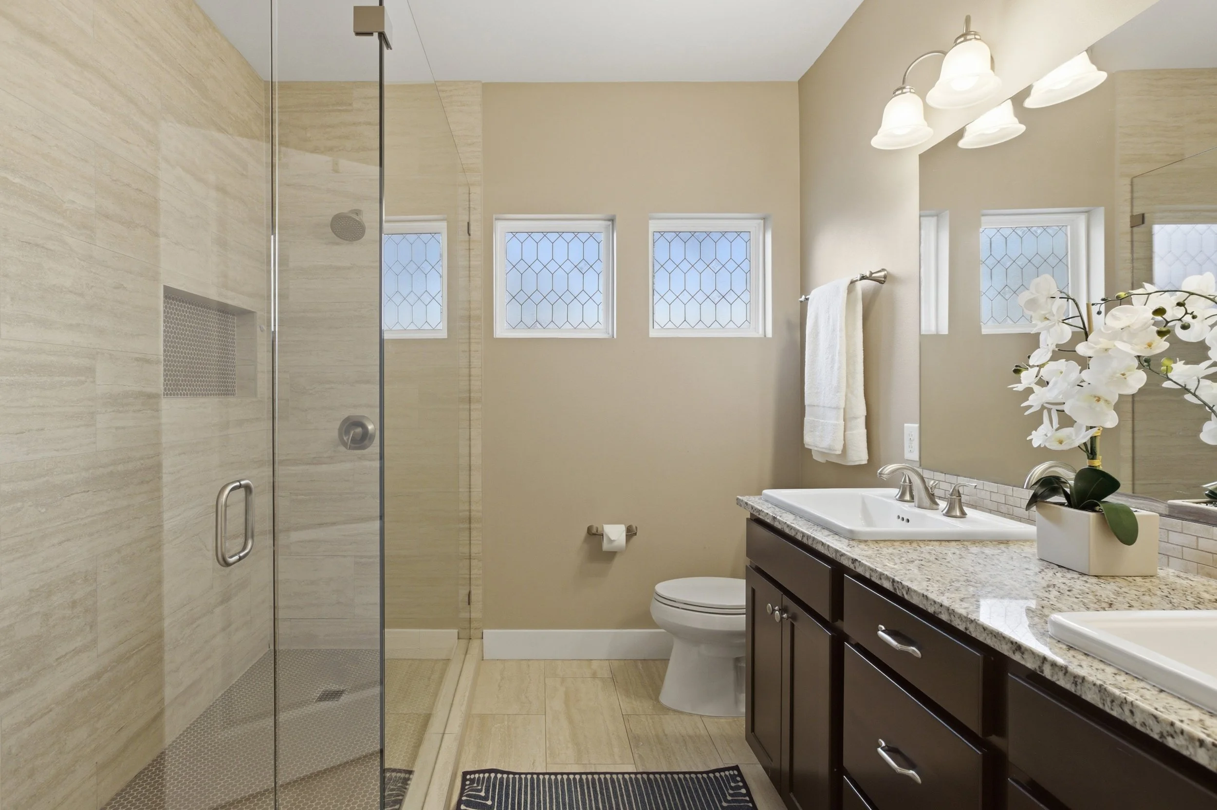 Primary bathroom in Brentwood Austin TX condo with modern finishes and clean, bright design.