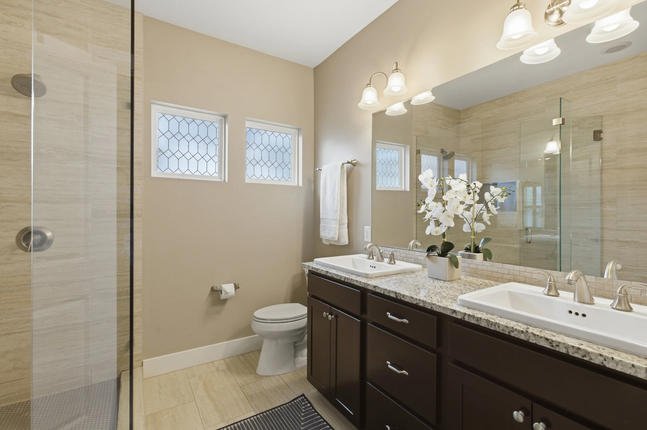 Primary bathroom in Brentwood Austin TX condo with modern finishes and clean, bright design.