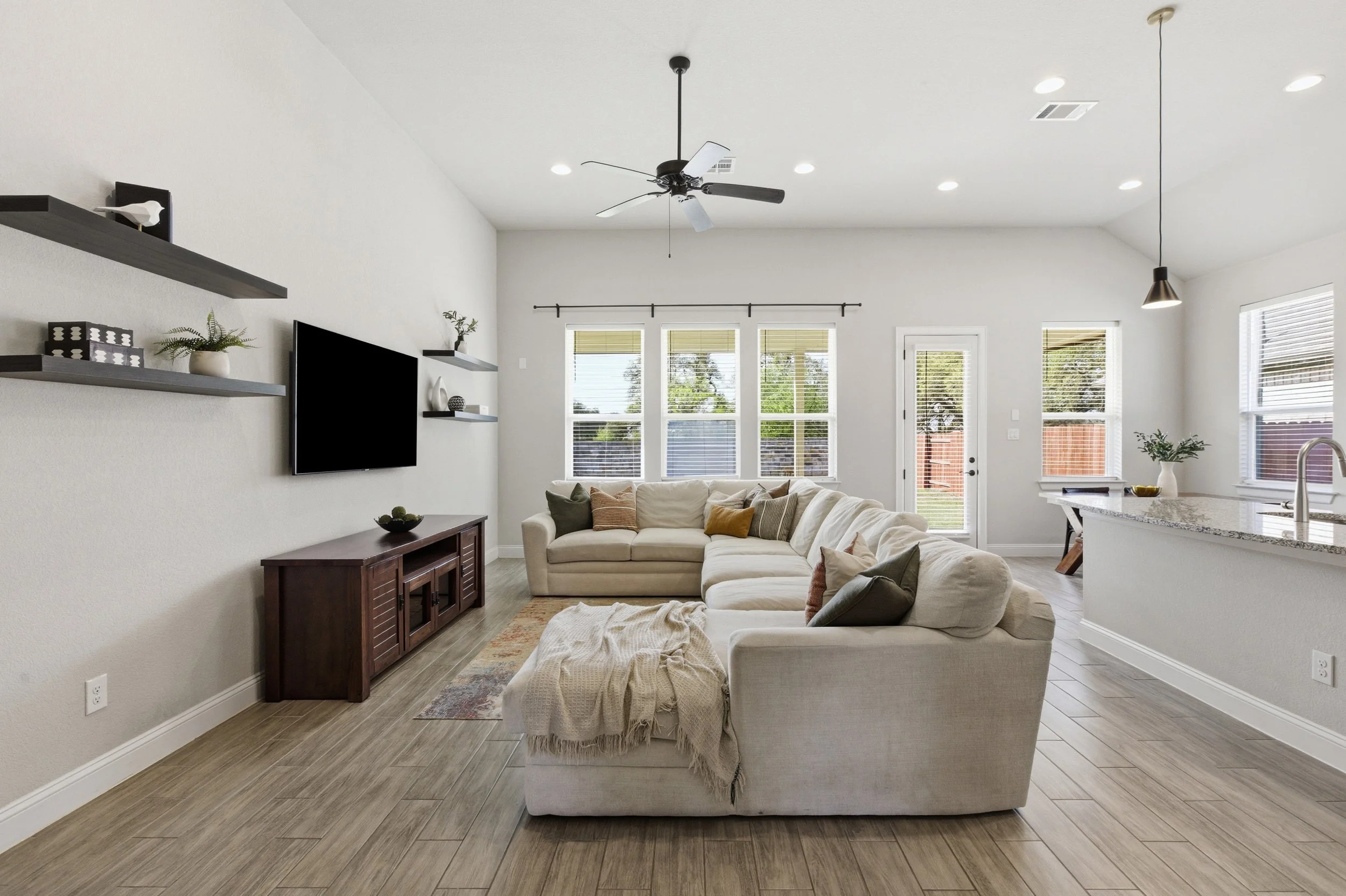 Living room connects to the kitchen and dining, open concept, spacious, lots of windows | Georgetown, TX