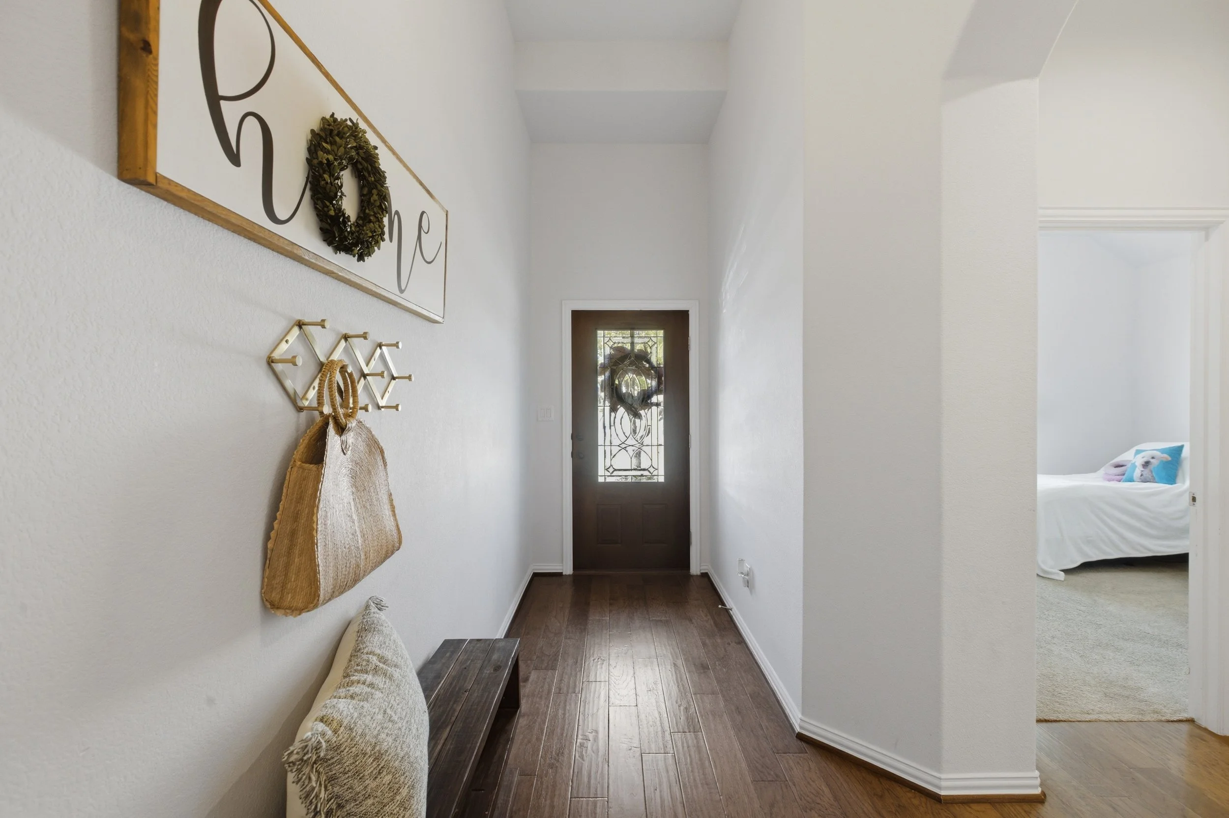 Bright entryway at 5386 Parma St Round Rock TX with high ceilings and open view into the main living space.
