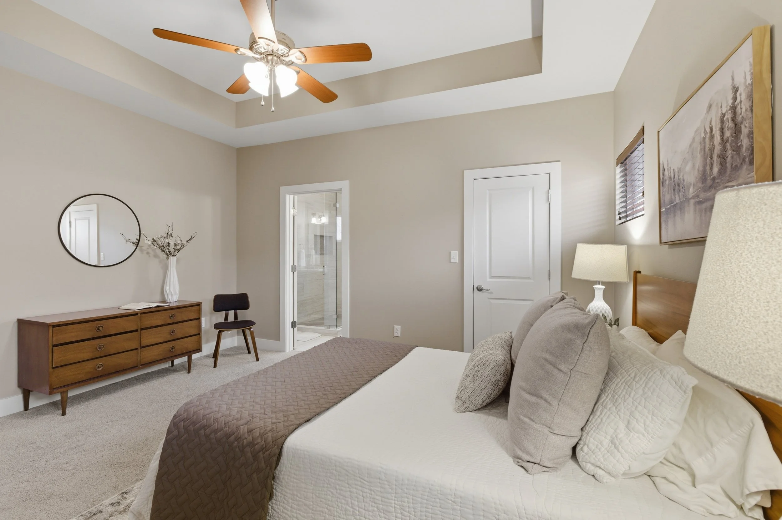 Private primary bedroom retreat in Brentwood Austin TX condo with soft natural light.